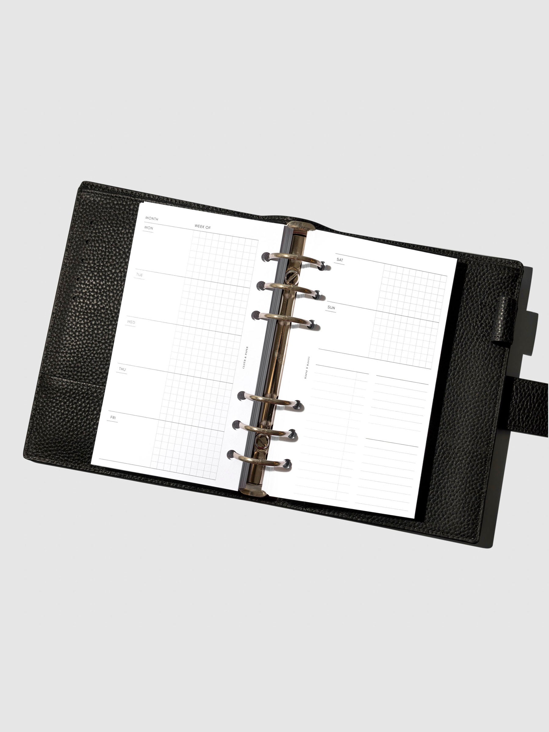Undated Horizontal Weekly Inserts in use inside a black leather planner.