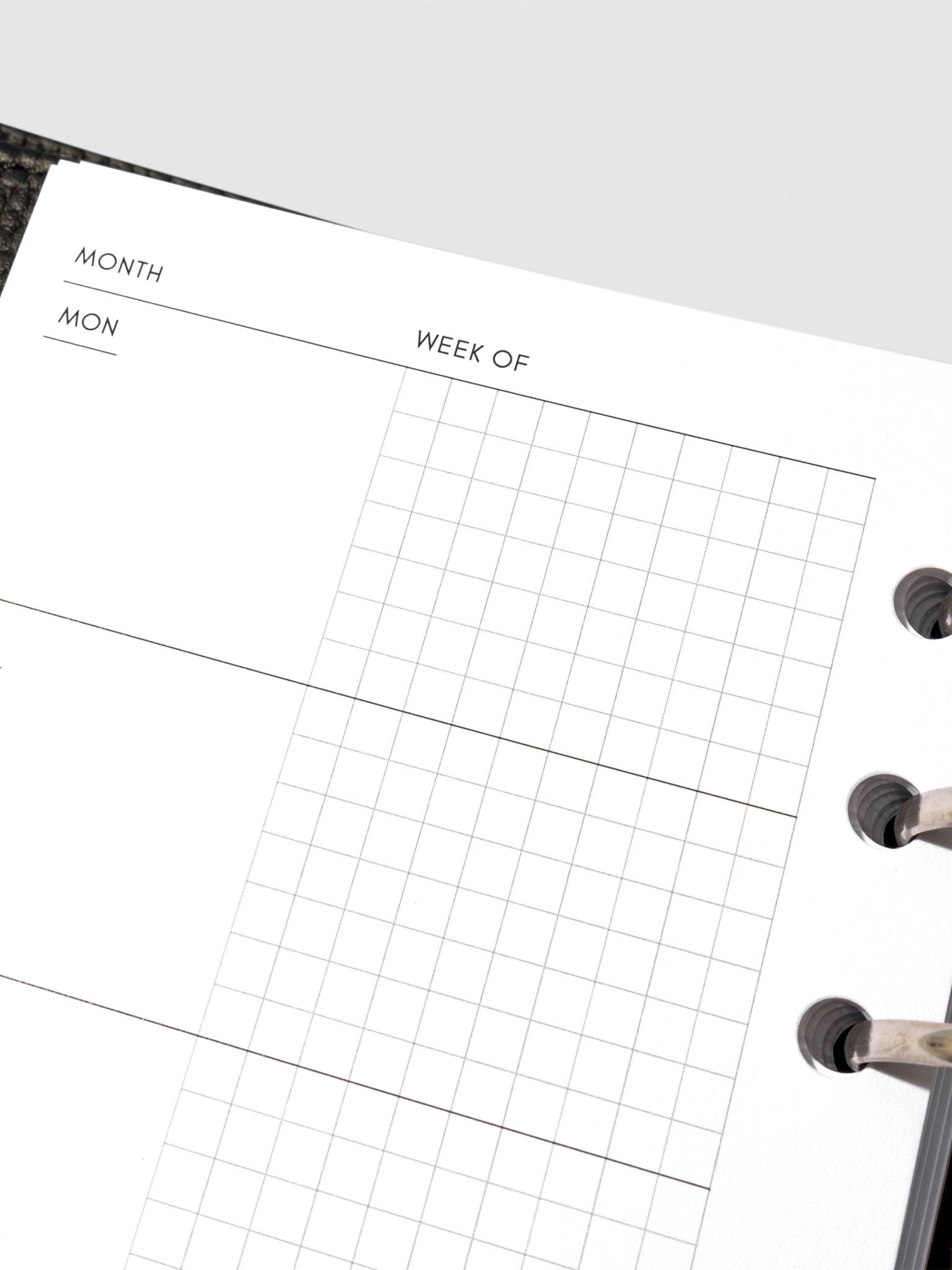 Undated Horizontal Weekly Inserts in use inside a black leather planner.