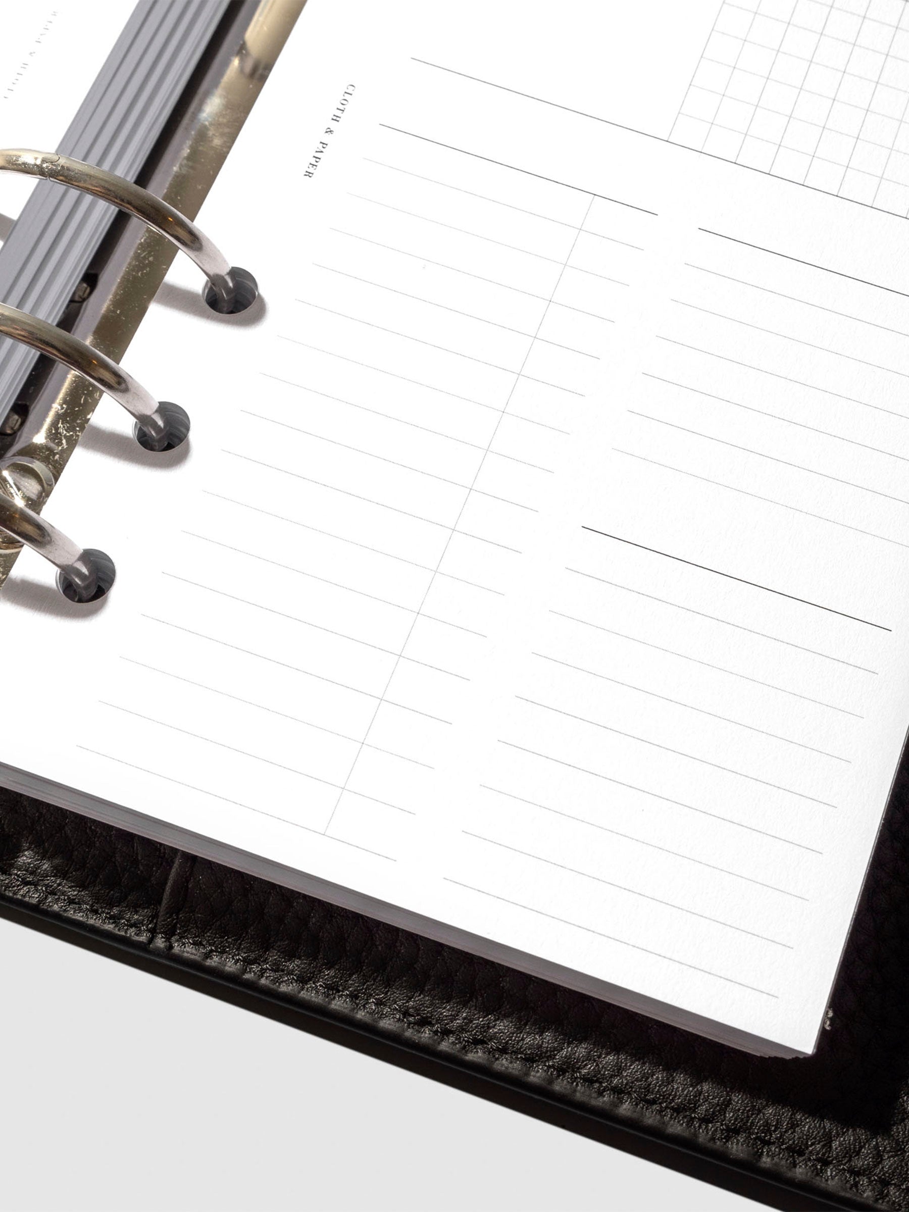 Undated Horizontal Weekly Inserts in use inside a black leather planner.