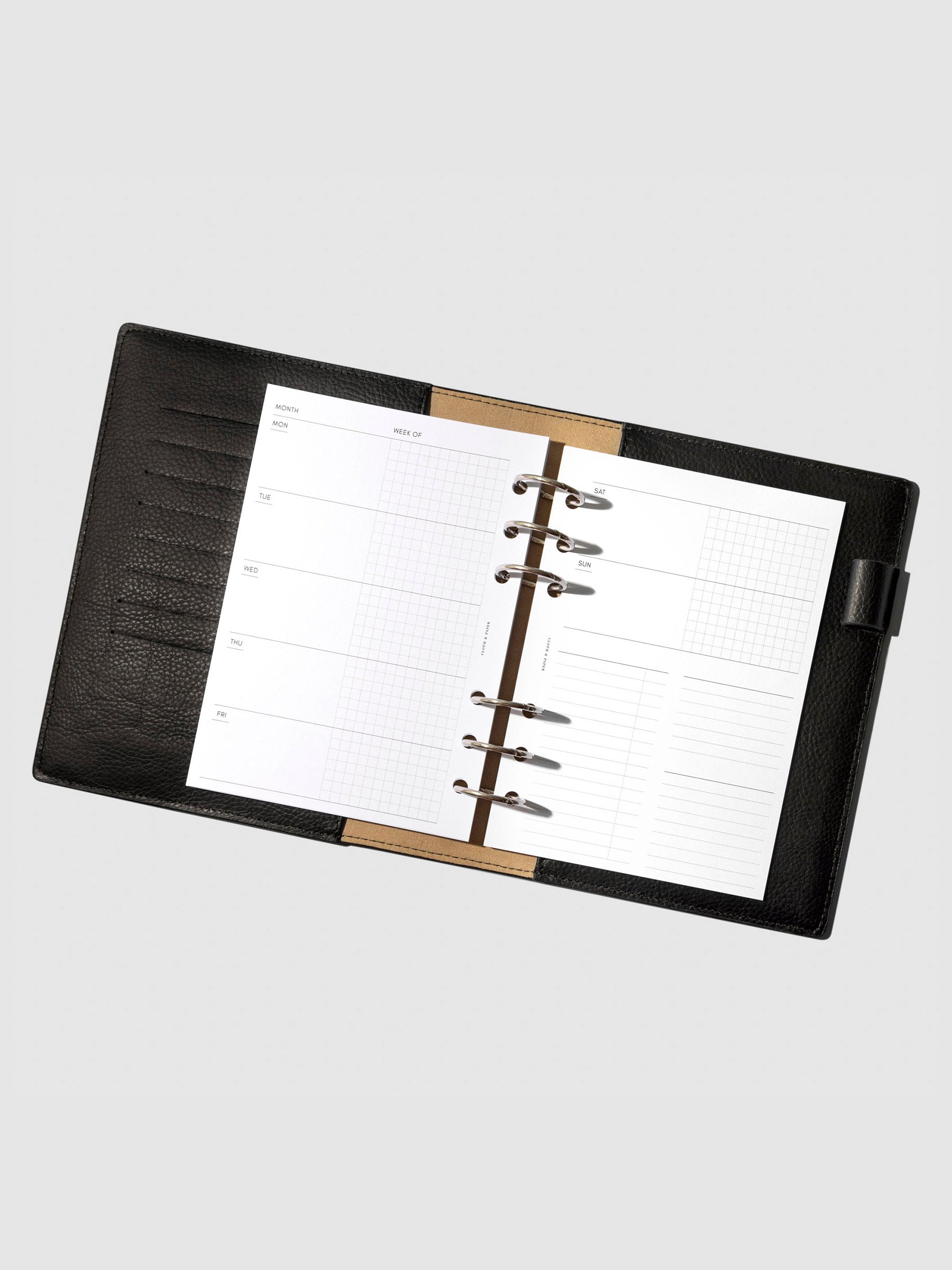 Undated Horizontal Weekly Inserts in use inside a black leather planner.