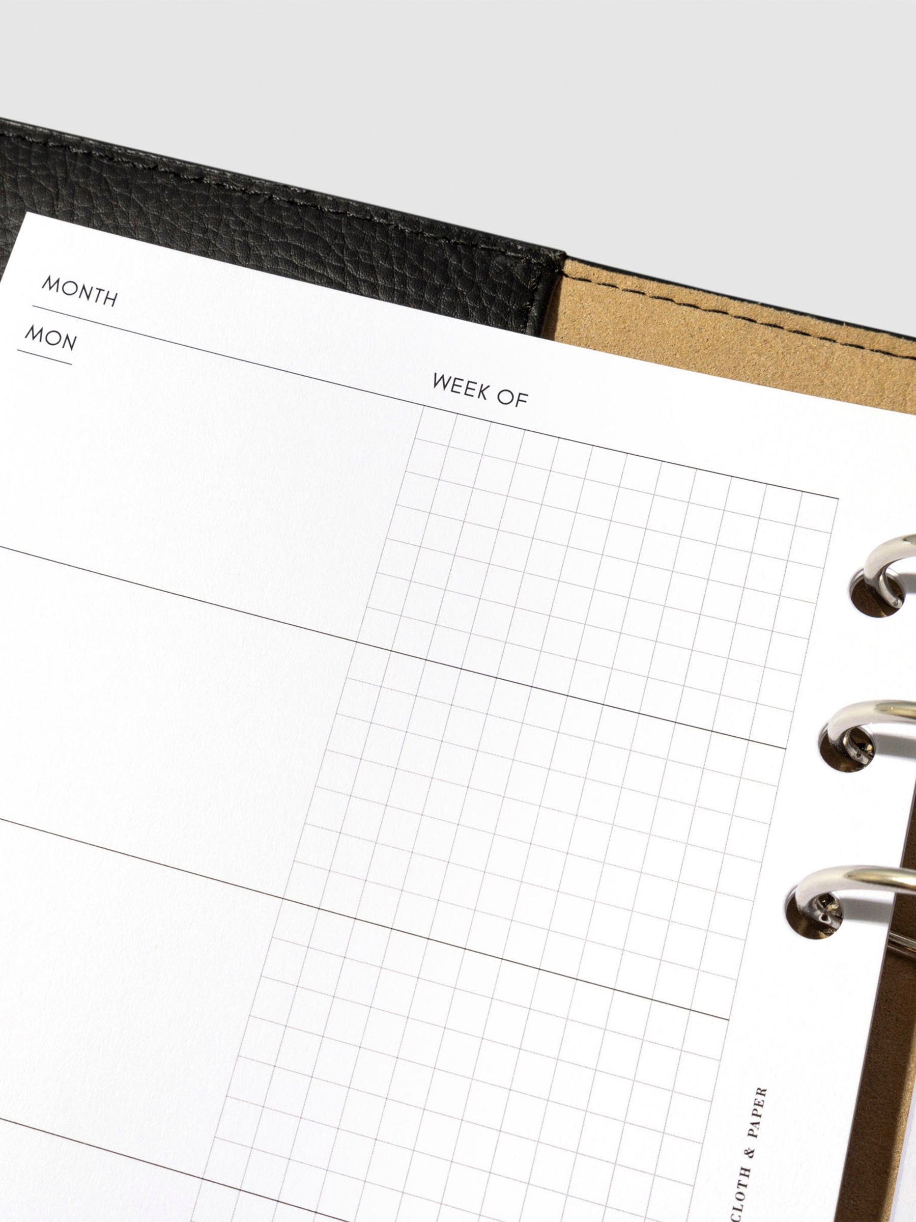 Undated Horizontal Weekly Inserts in use inside a black leather planner.