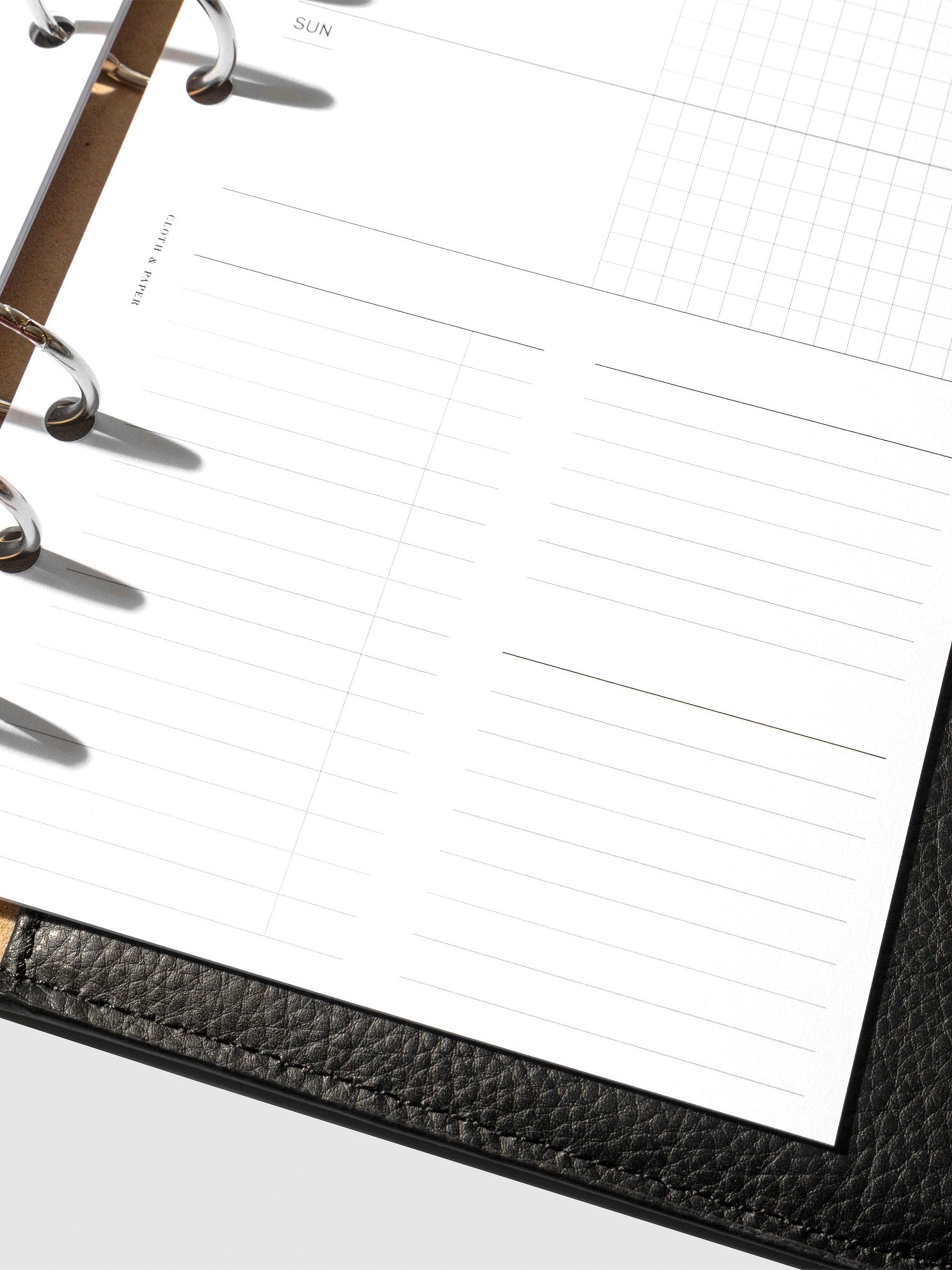 Undated Horizontal Weekly Inserts in use inside a black leather planner.