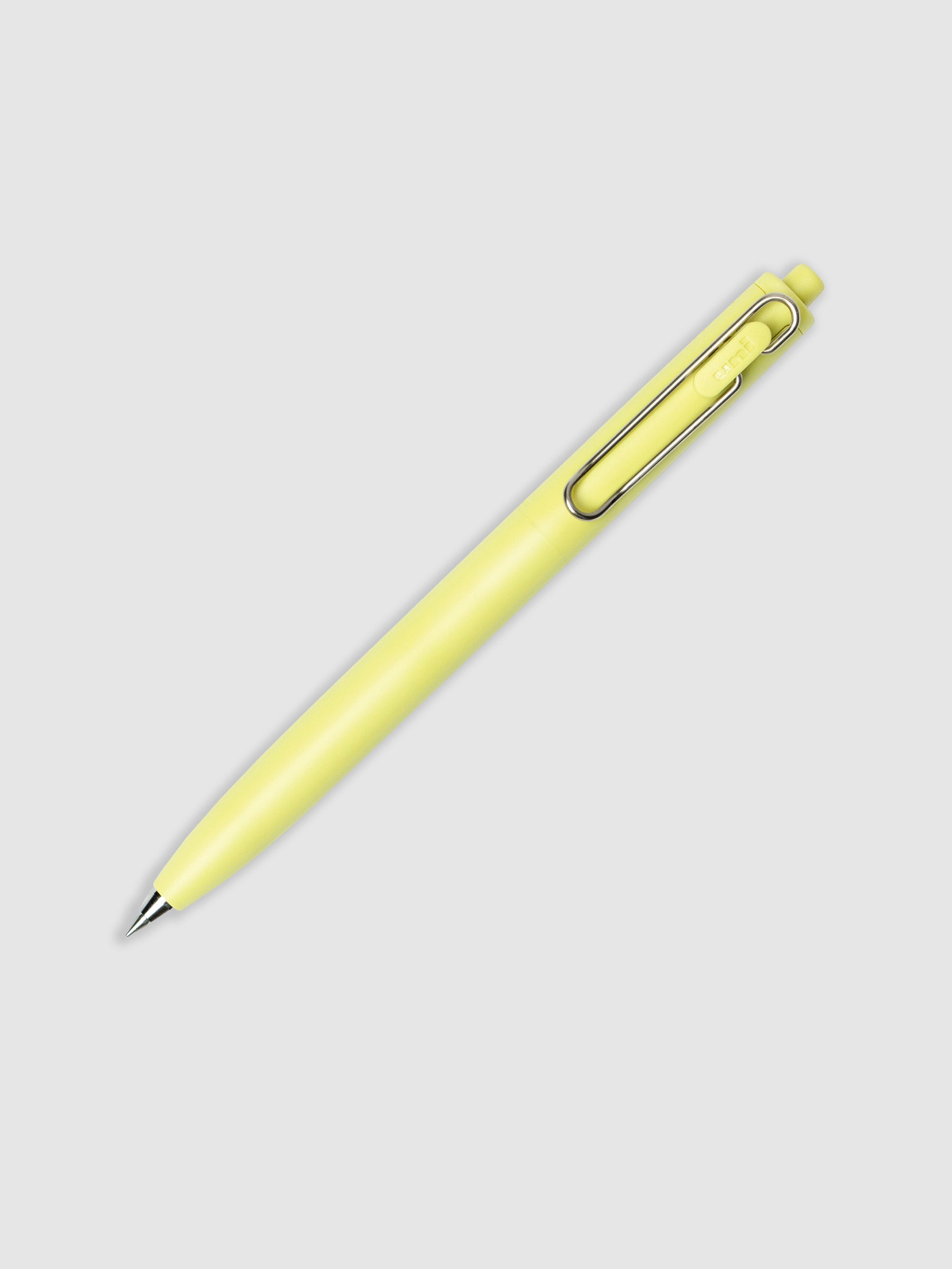 Yellow pen turned to the right against a neutral background.