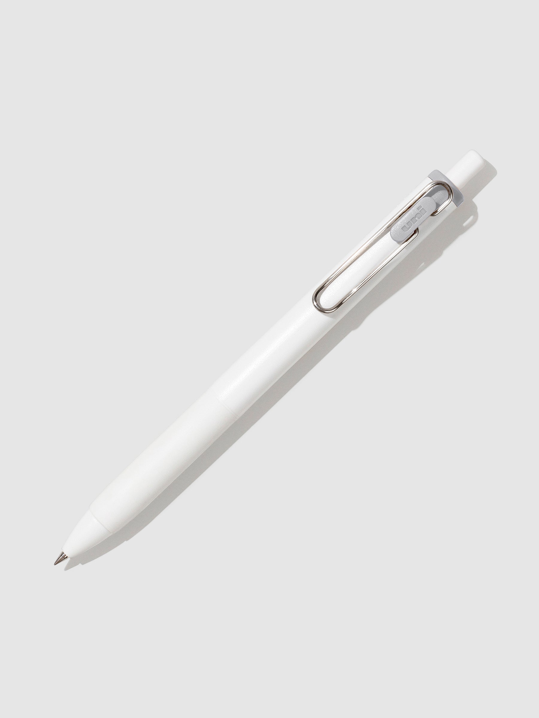 Pen tilted slightly to the right on a neutral background. Color pictured is Sesame Gray.