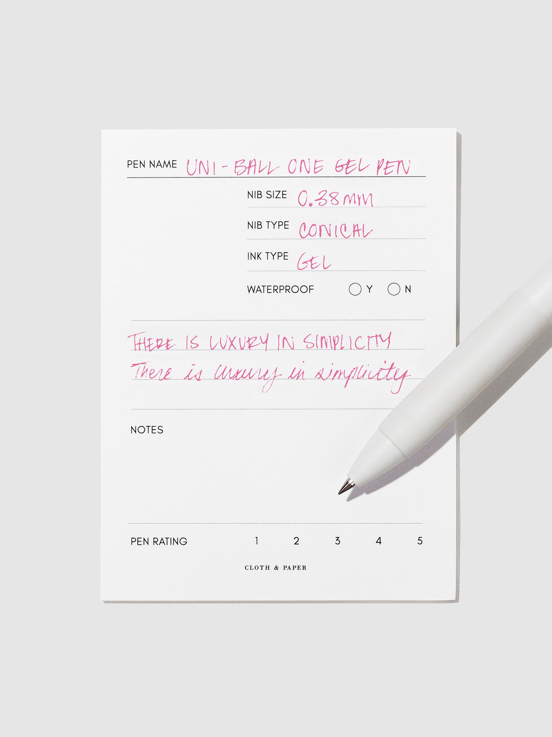 Pen tilted slightly to the right on a neutral background. Color pictured is Pink.