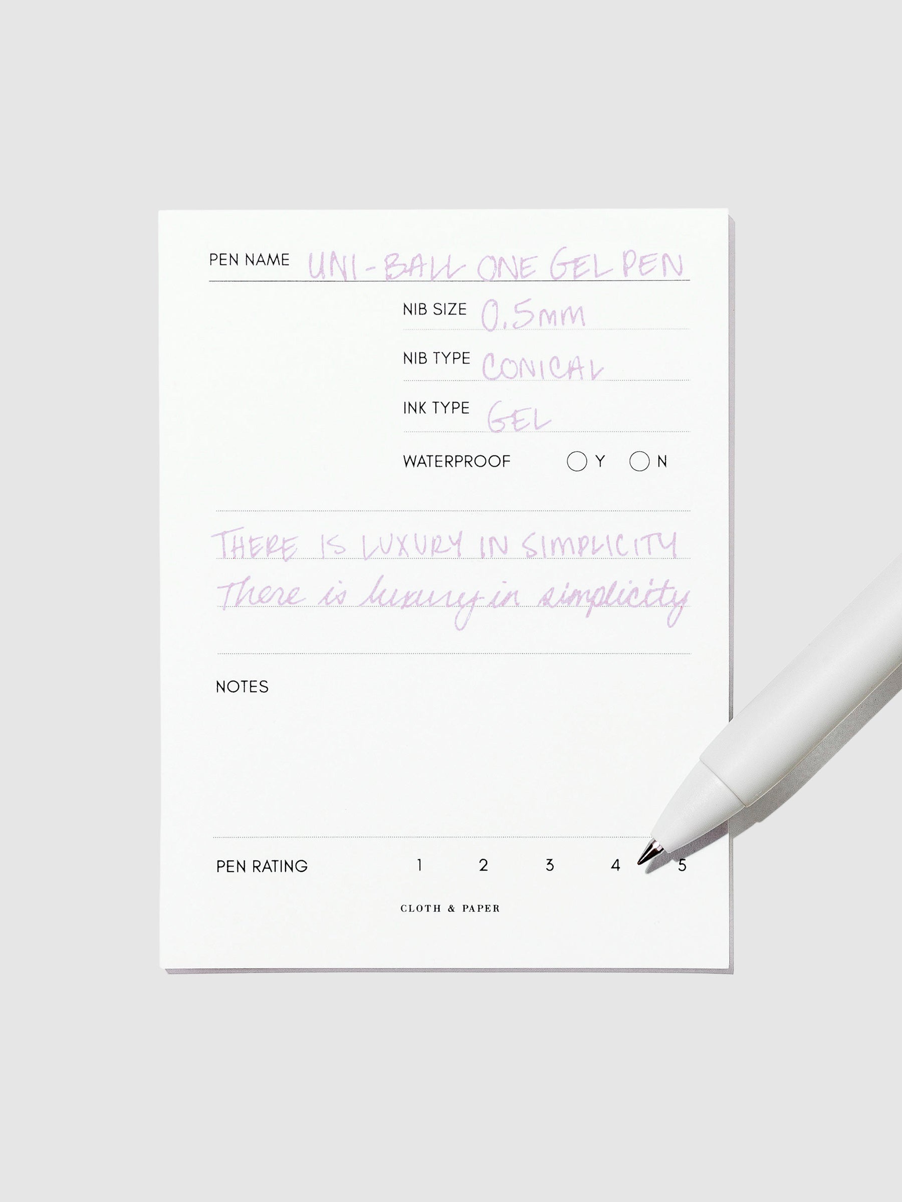 Pen tilted slightly to the right on a neutral background. Color pictured is Plum Purple.