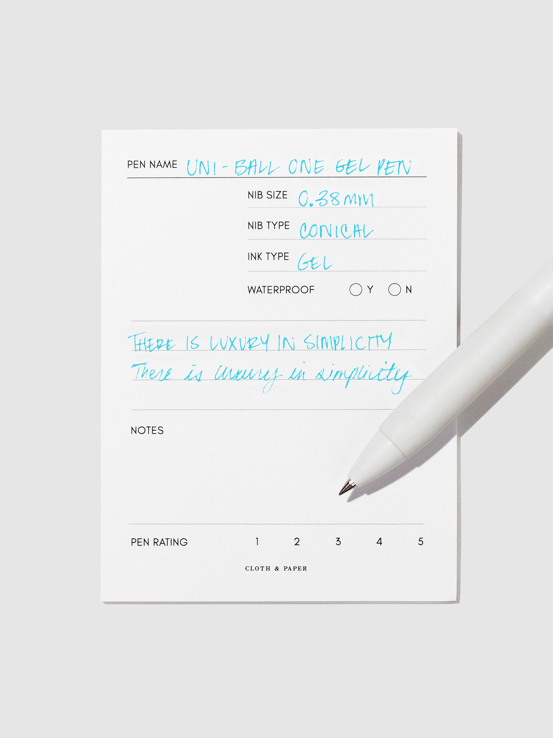 Pen tilted slightly to the right on a neutral background. Color pictured is Sunny Day Blue.