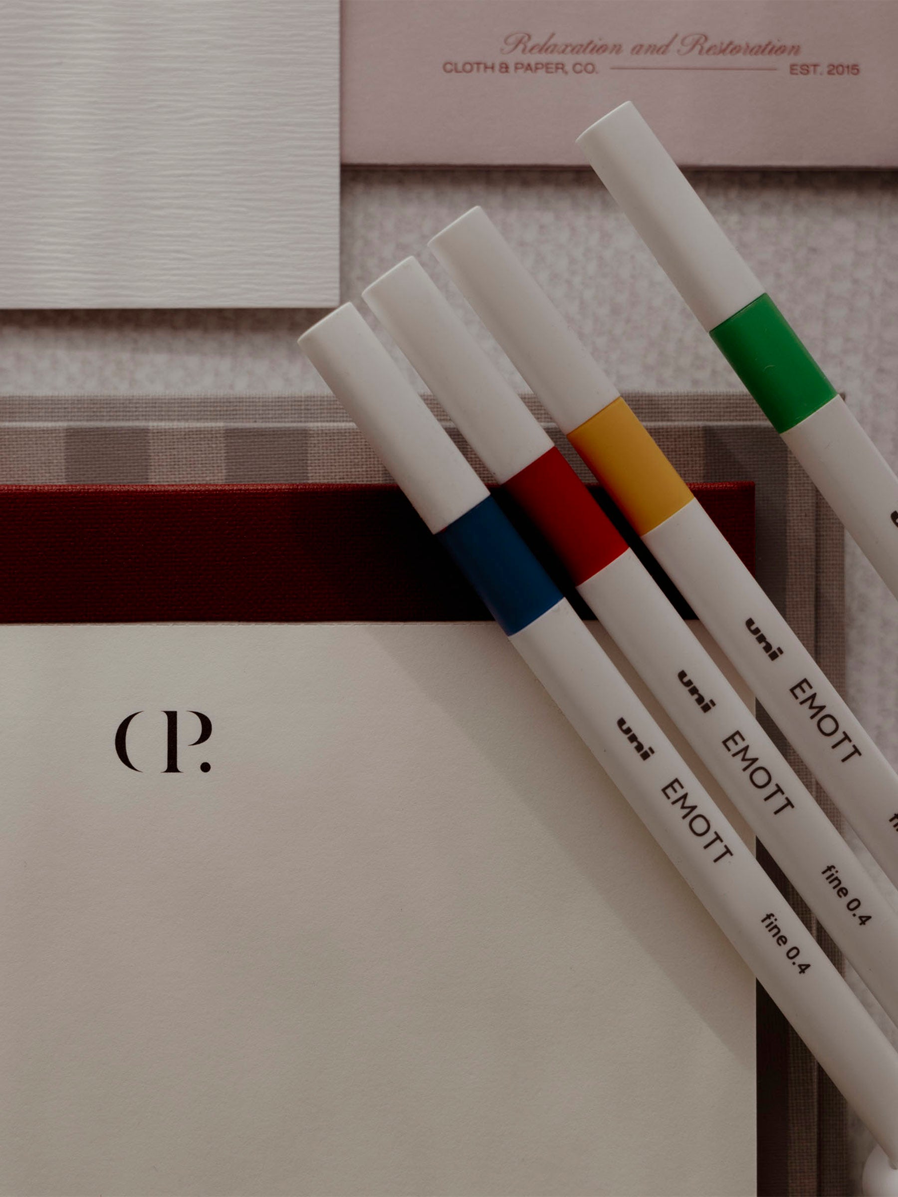 Four Uni Emotts displayed on top of a Rilassati folio.