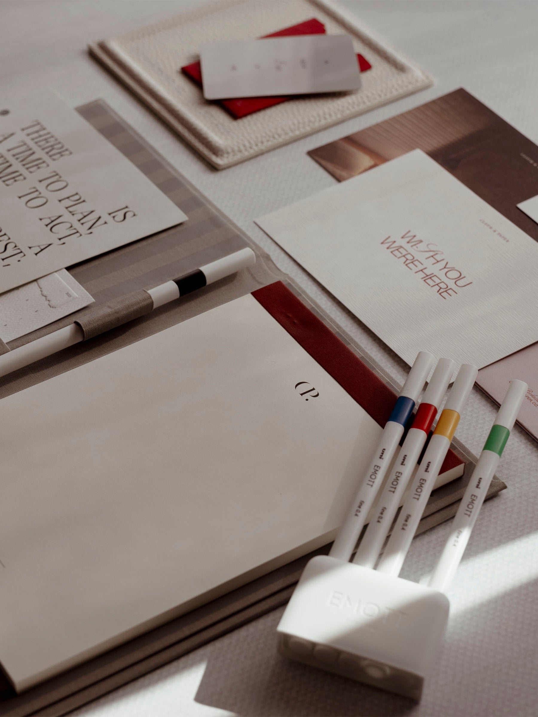 Four Uni Emotts displayed on top of a Rilassati folio.