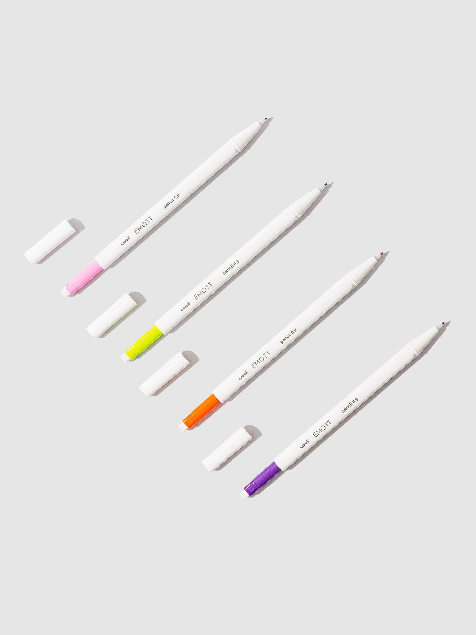 Tropical color pencils displayed on a neutral background.