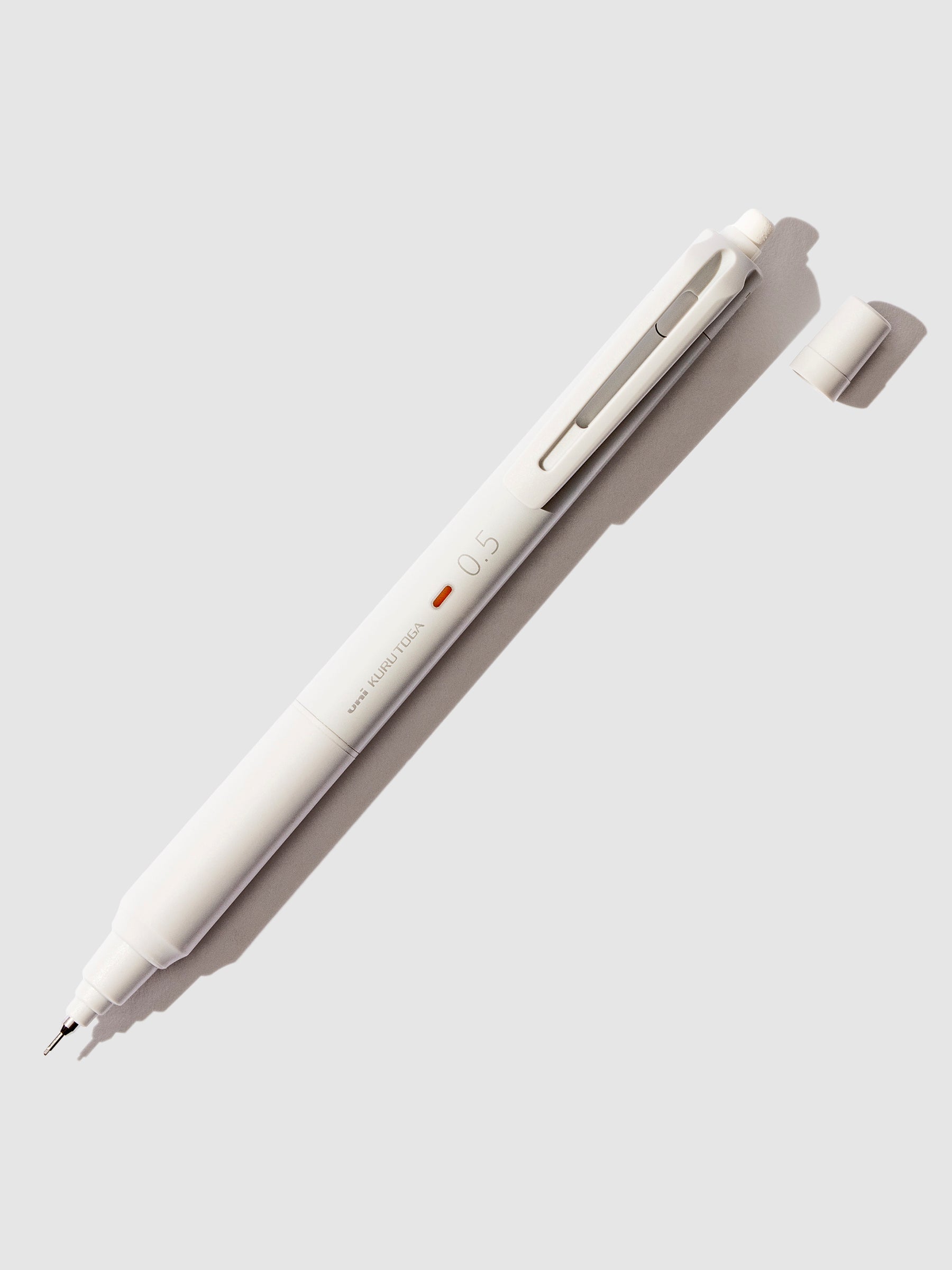 Uni Kuru Toga KS Mechanical Pencil, Cloth and Paper. Grey pencil displayed on a neutral background.