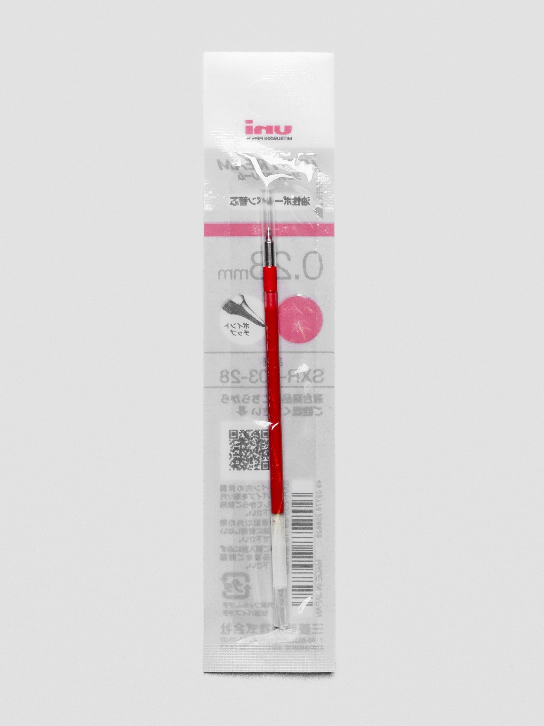 Front view of a pen refill with red ink shown in packaging.