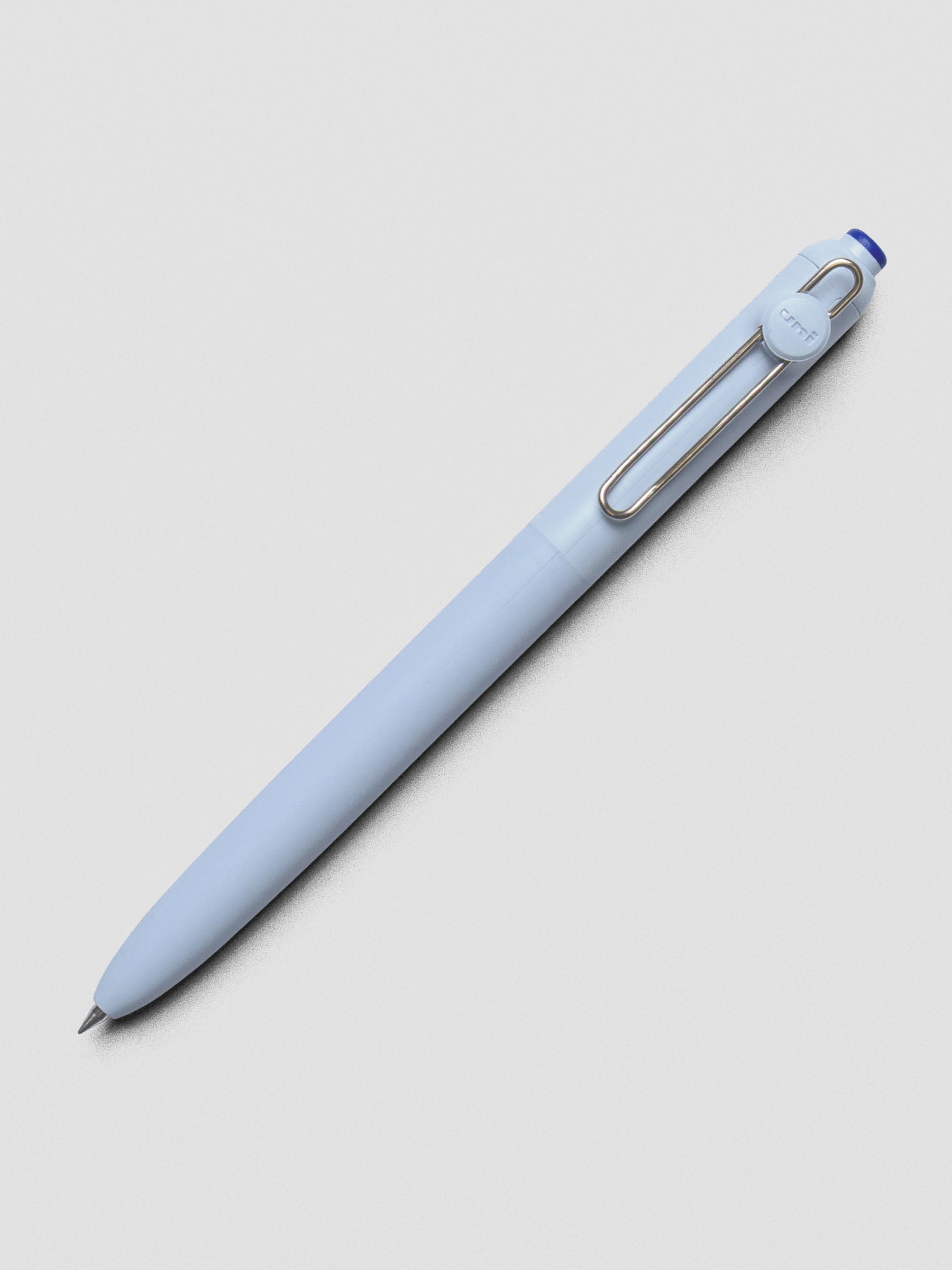 Blue pen shown at an angle with a silver clip.