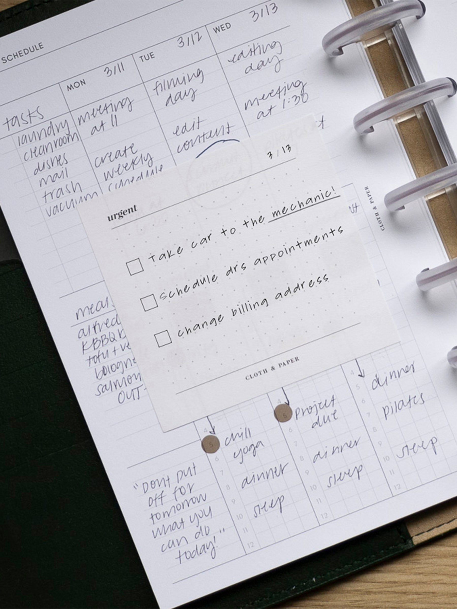 Sticky note placed inside of a weekly planner insert.