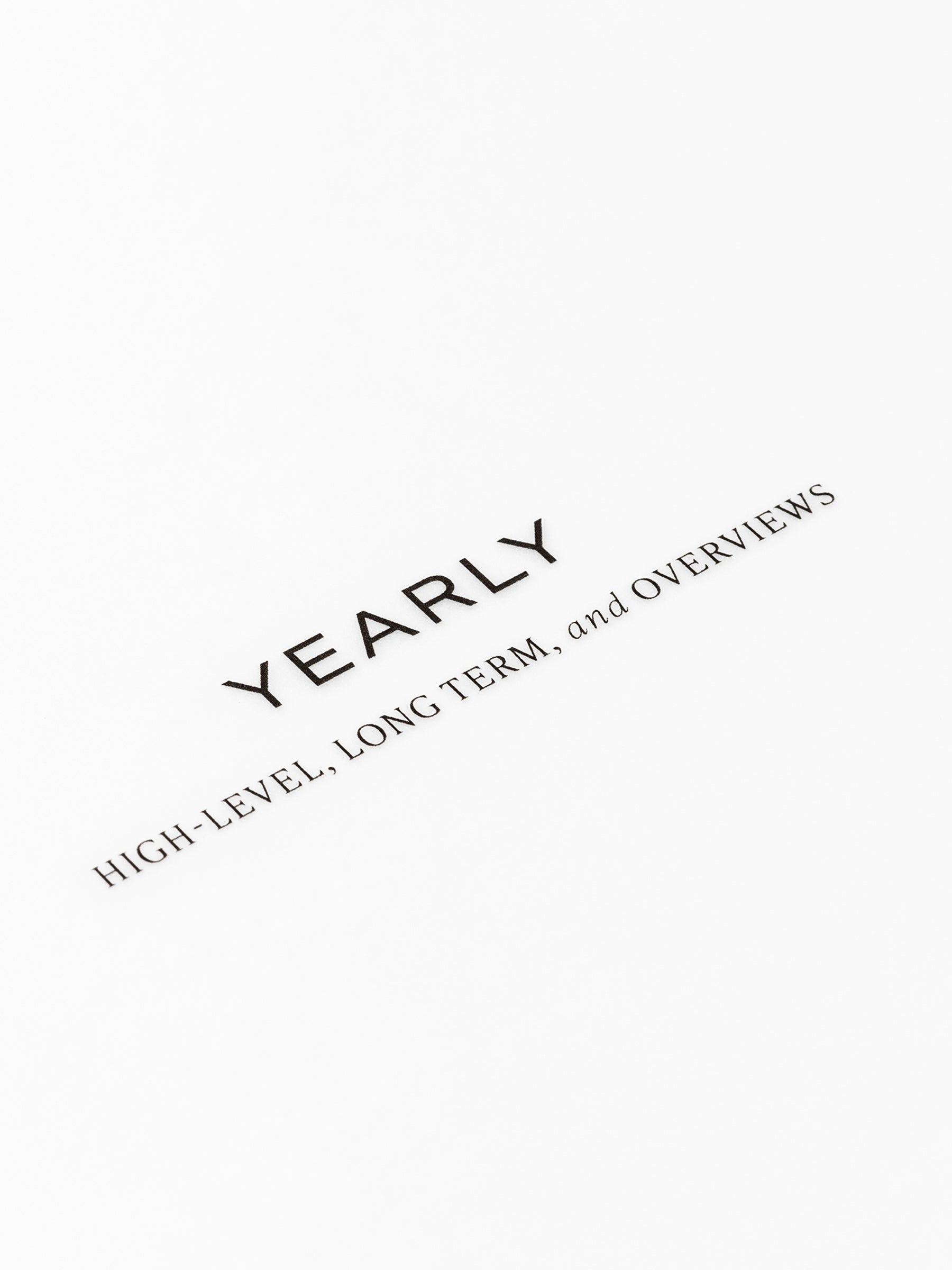 Closeup of text reading "yearly | high-level, long term, and overviews"