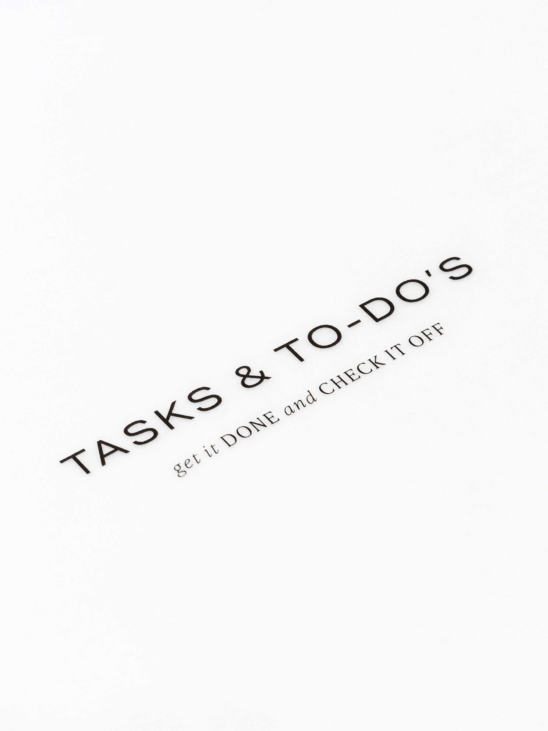 Closeup of text reading "tasks and to-do's | get it done and check it off"