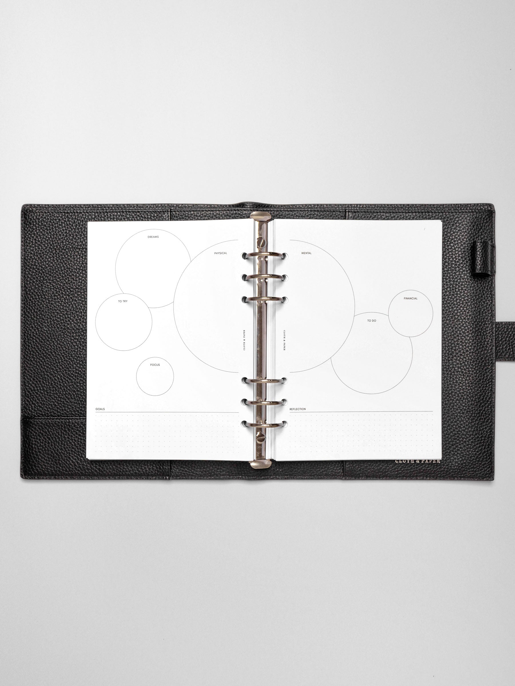 Insert in use inside a black leather planner.
