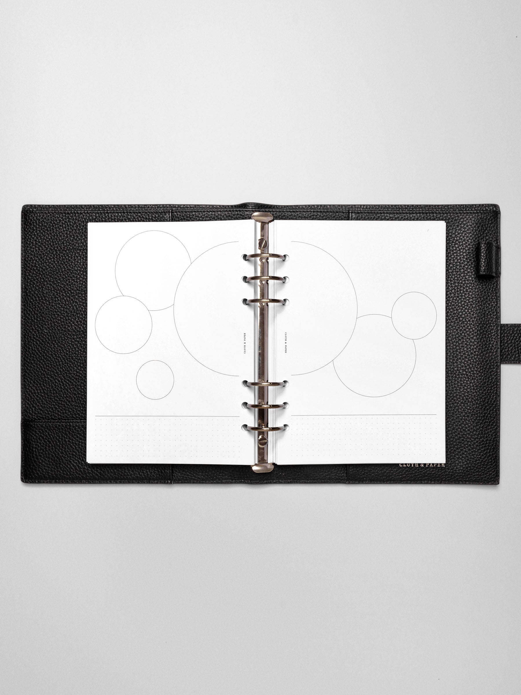 Insert in use inside a black leather planner.
