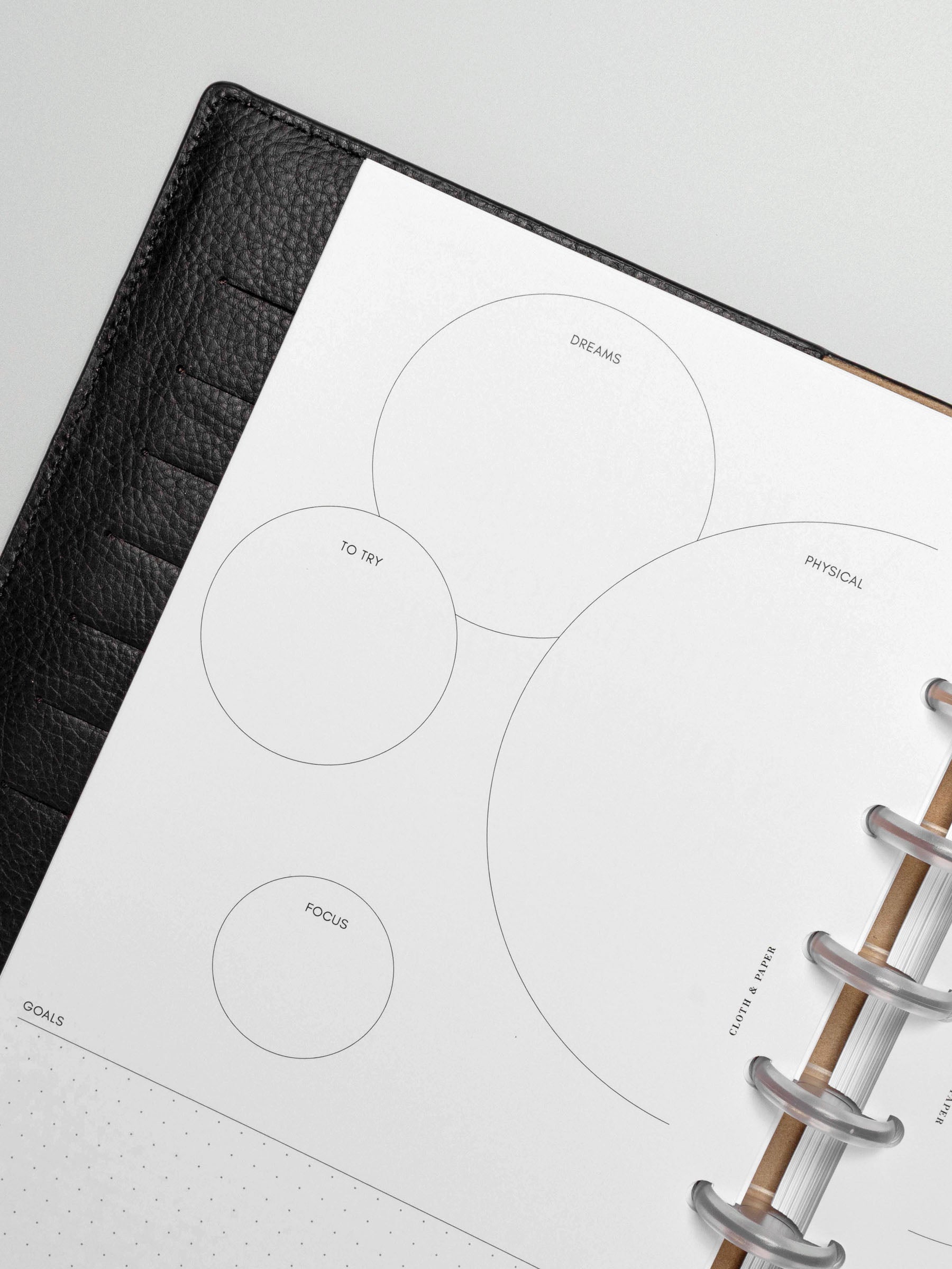 Insert in use inside a black leather planner.