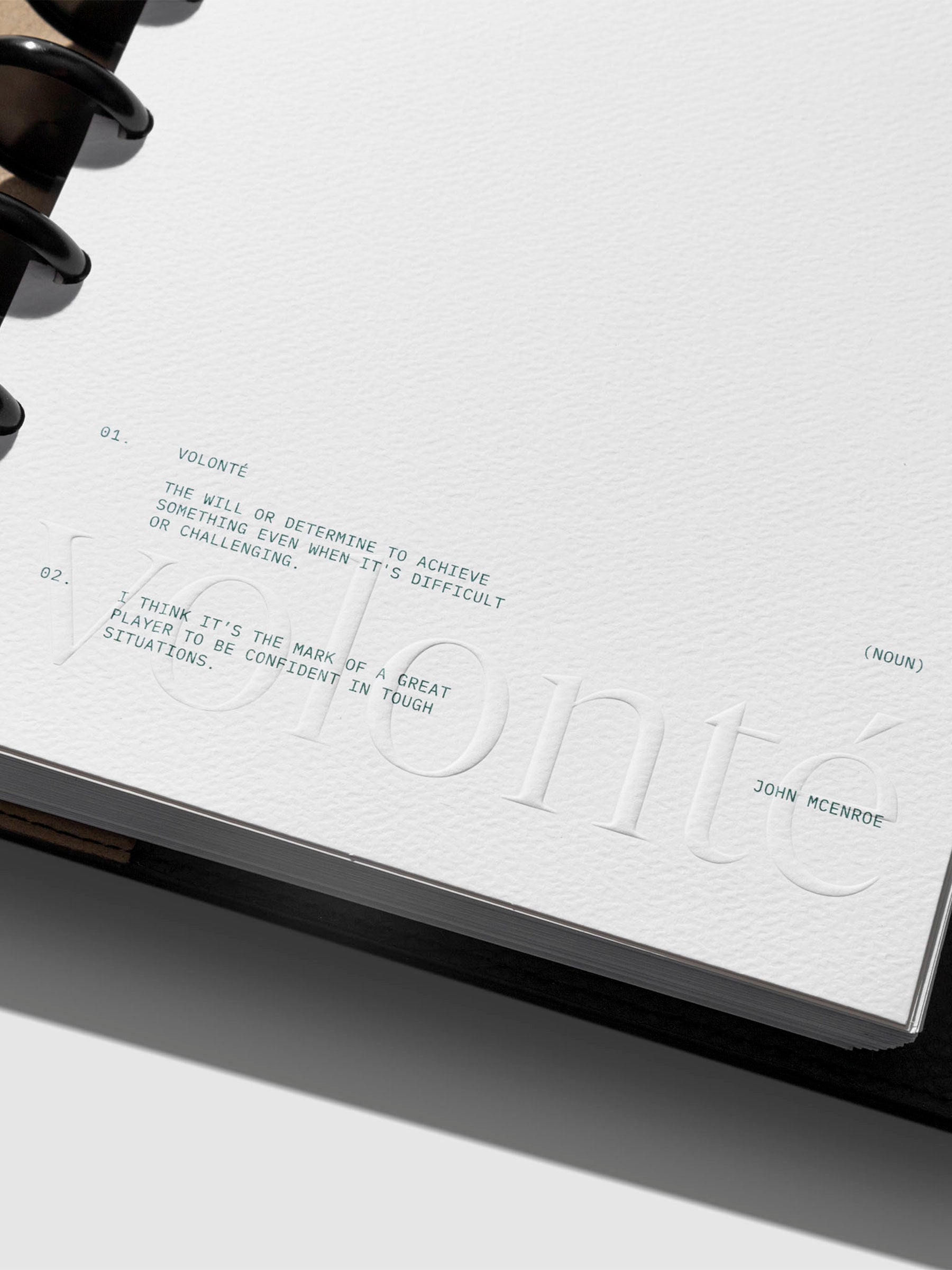 Closeup of dashboard's embossed texture and green printed text.