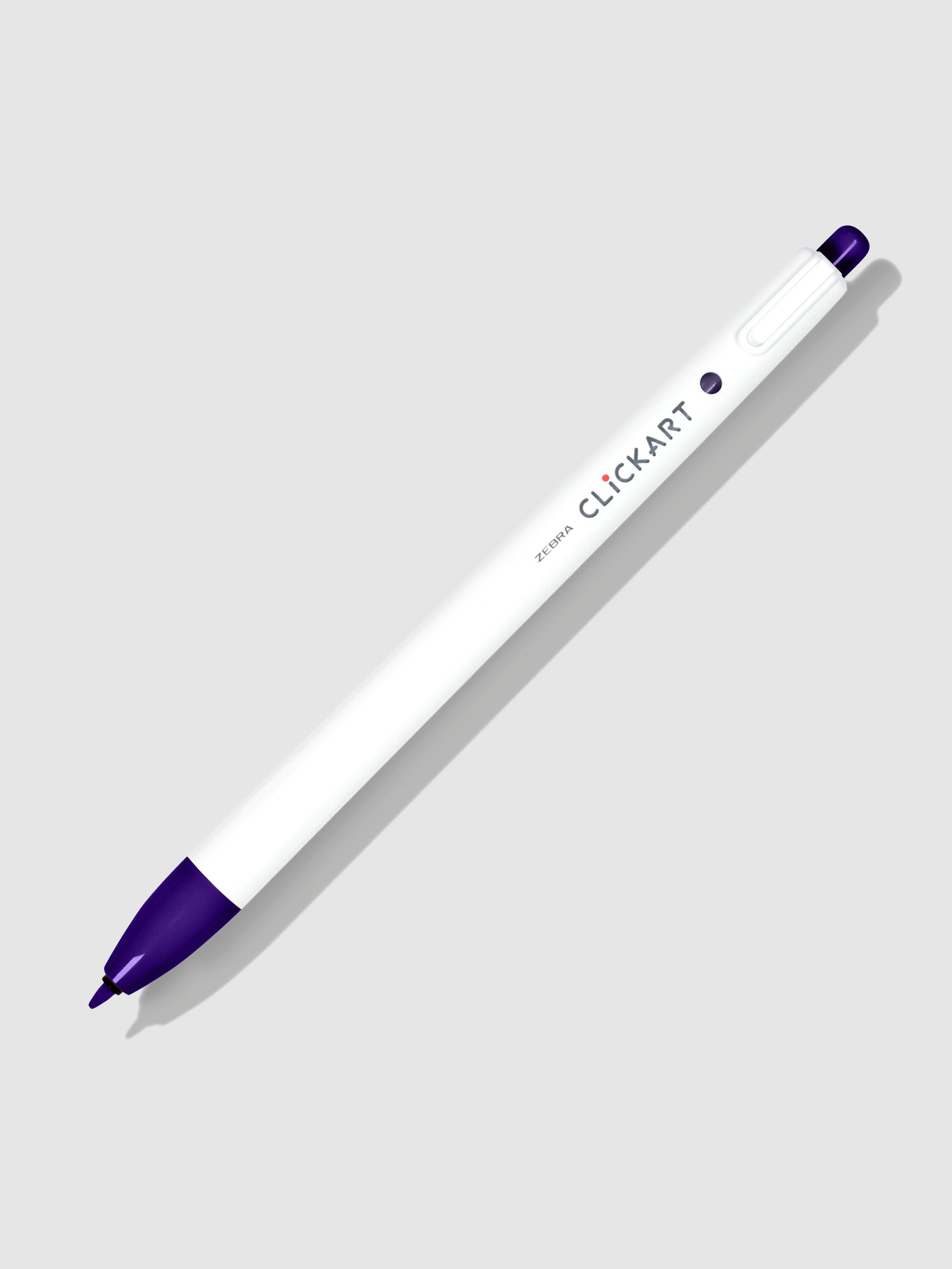 Zebra Clickart Marker in Purple tilted to the right on a neutral background with its nib exposed.