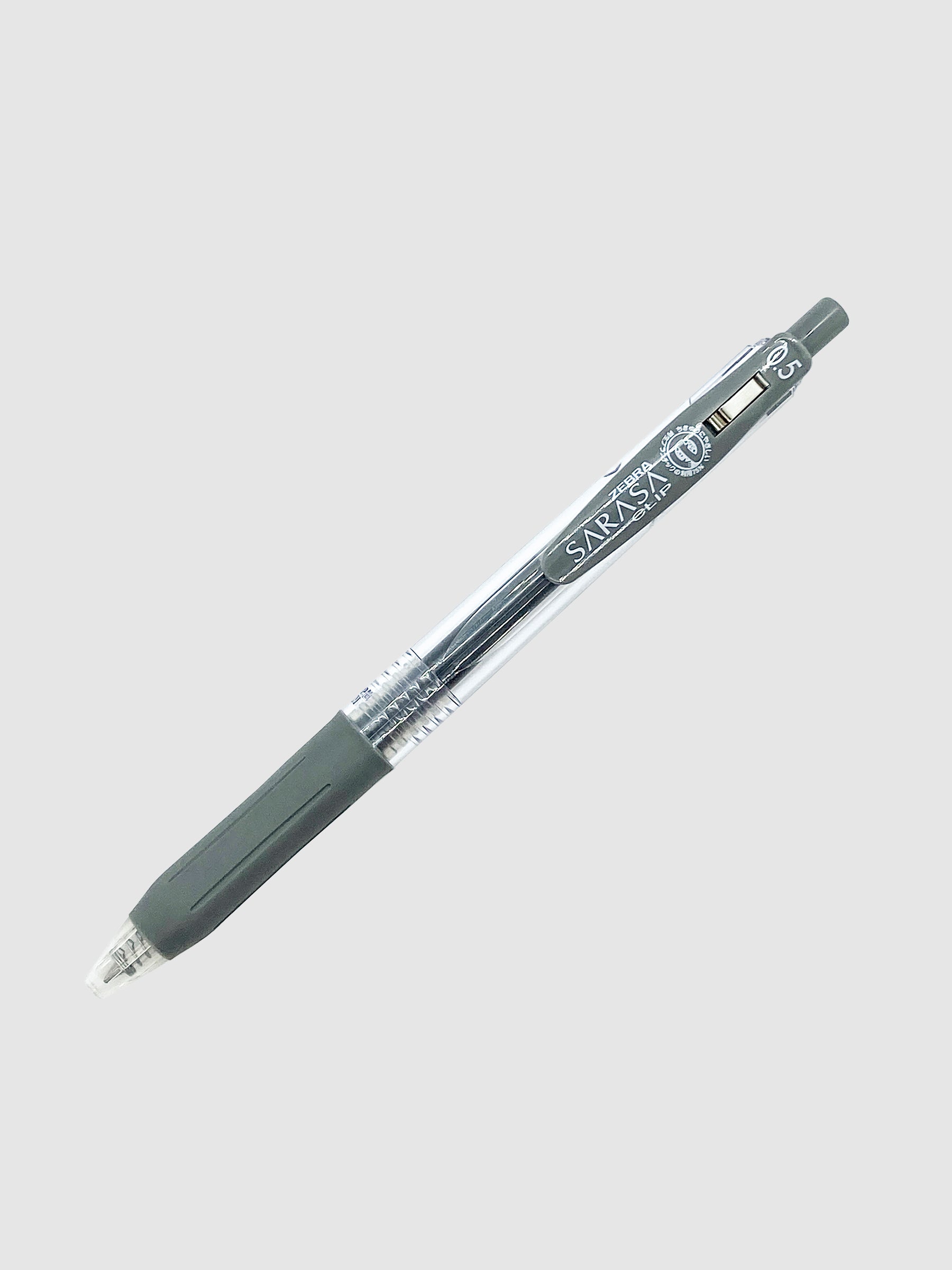 Zebra Sarasa Clip, 0.5 mm, Gray, Cloth and Paper. Pen turned to the right against a neutral background.