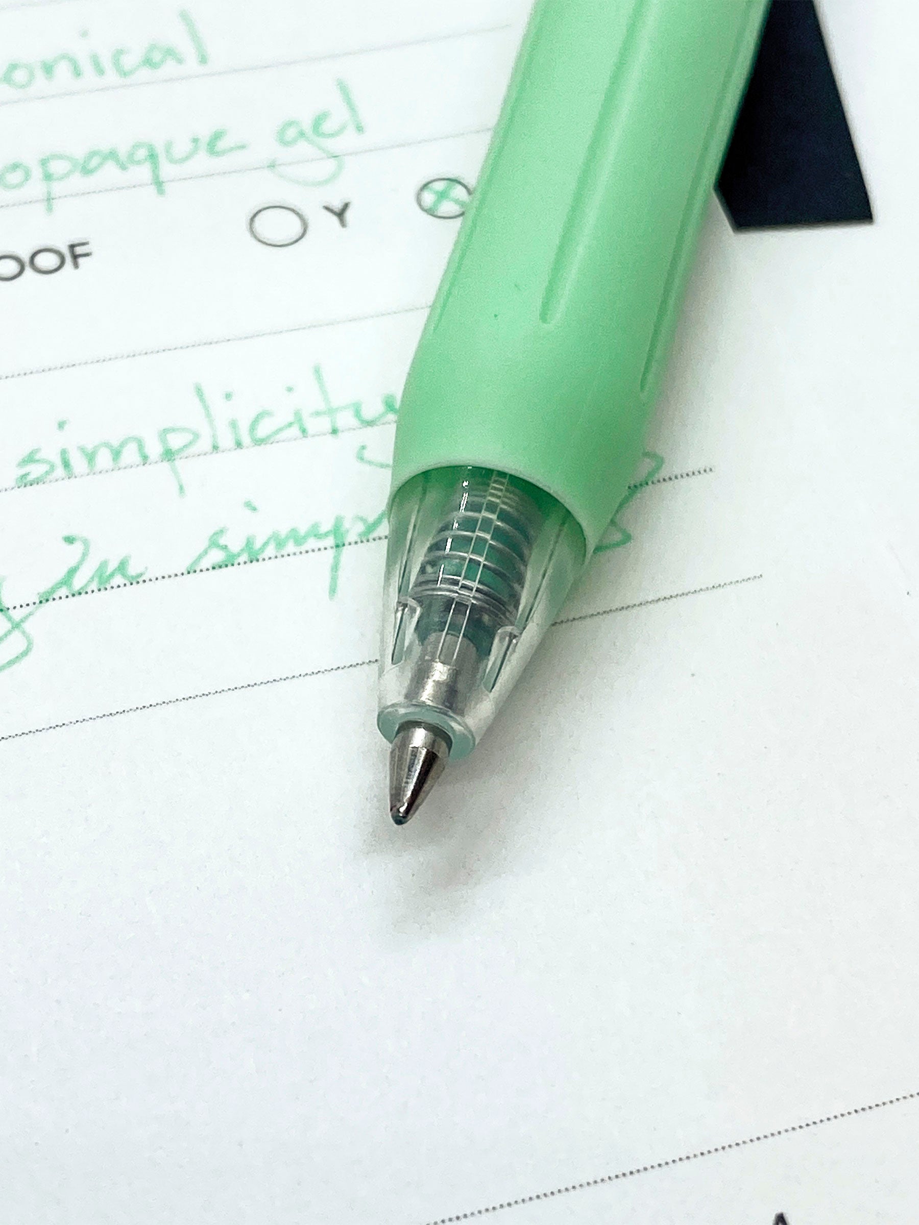 Zebra Sarasa Clip, 0.5 mm, Milk Green, Cloth and Paper. Close up on pen nib and writing sample.