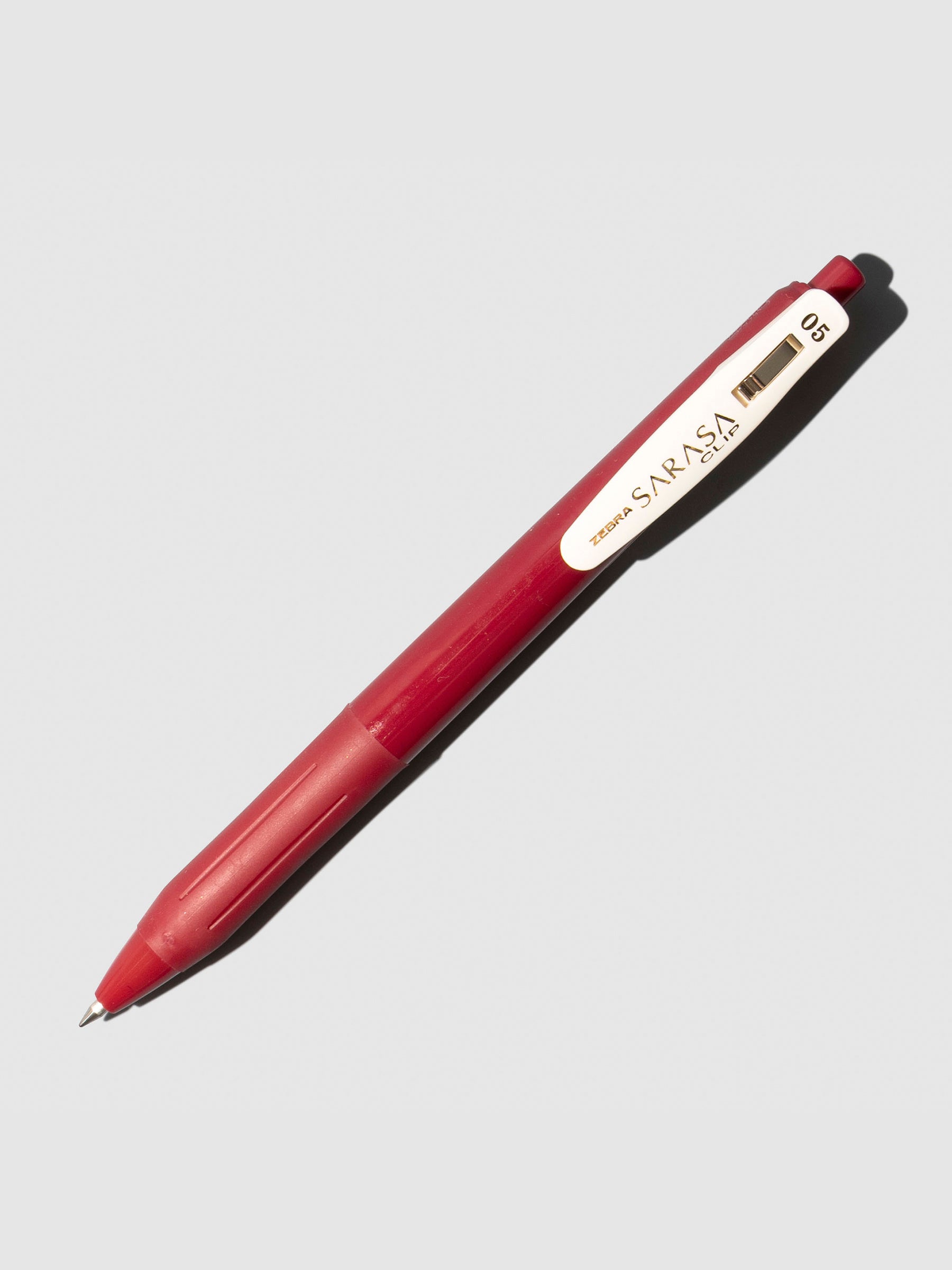 Zebra Sarasa Clip Gel Pen, Cloth and Paper. Pen displayed on a neutral background. Color shown is Cassis Black.
