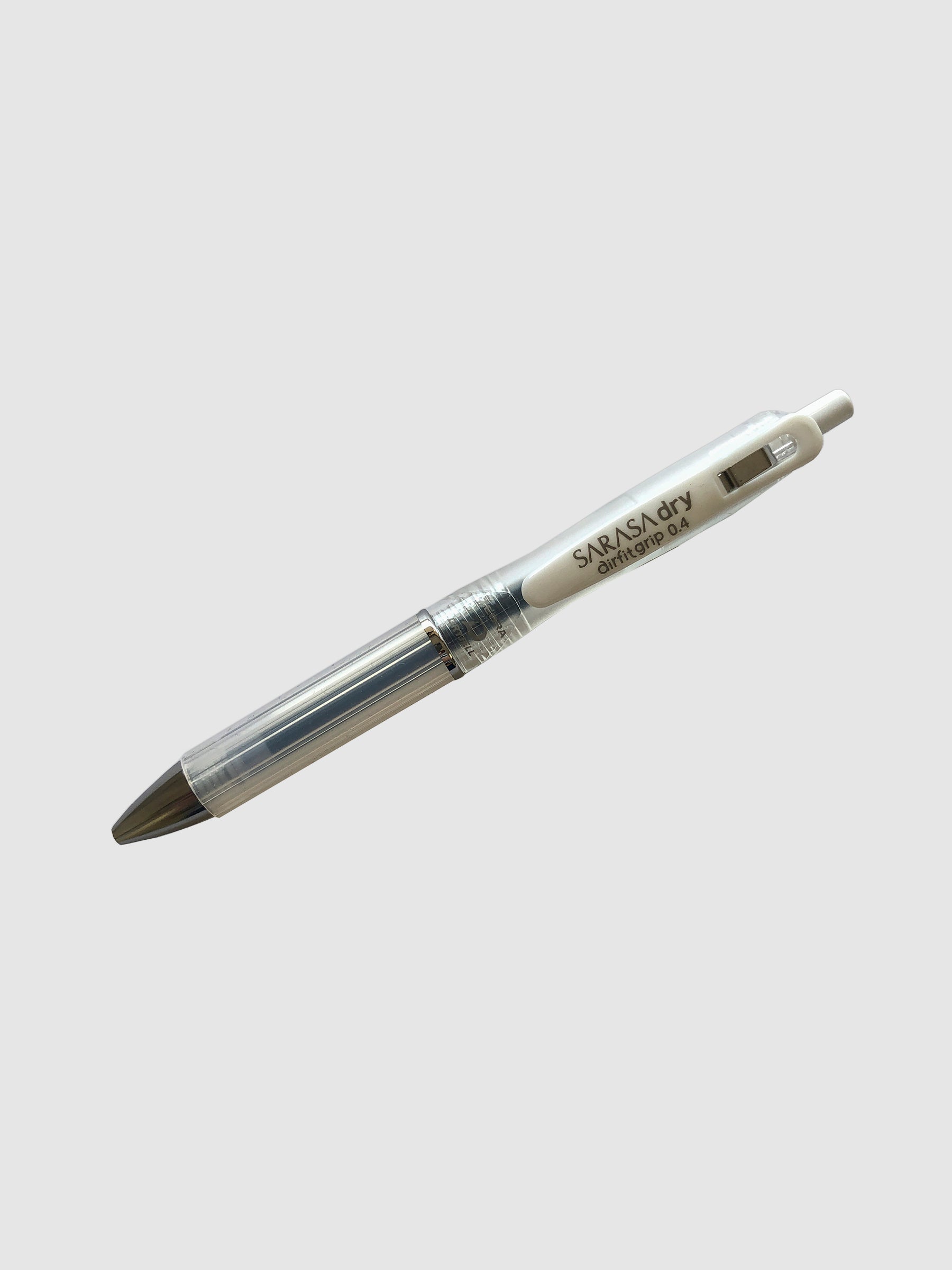 Zebra Sarasa Dry Airfit Grip Rollerball Pen, Clear, 0.4mm, Cloth & Paper. Pen turned to the left against a neutral background.