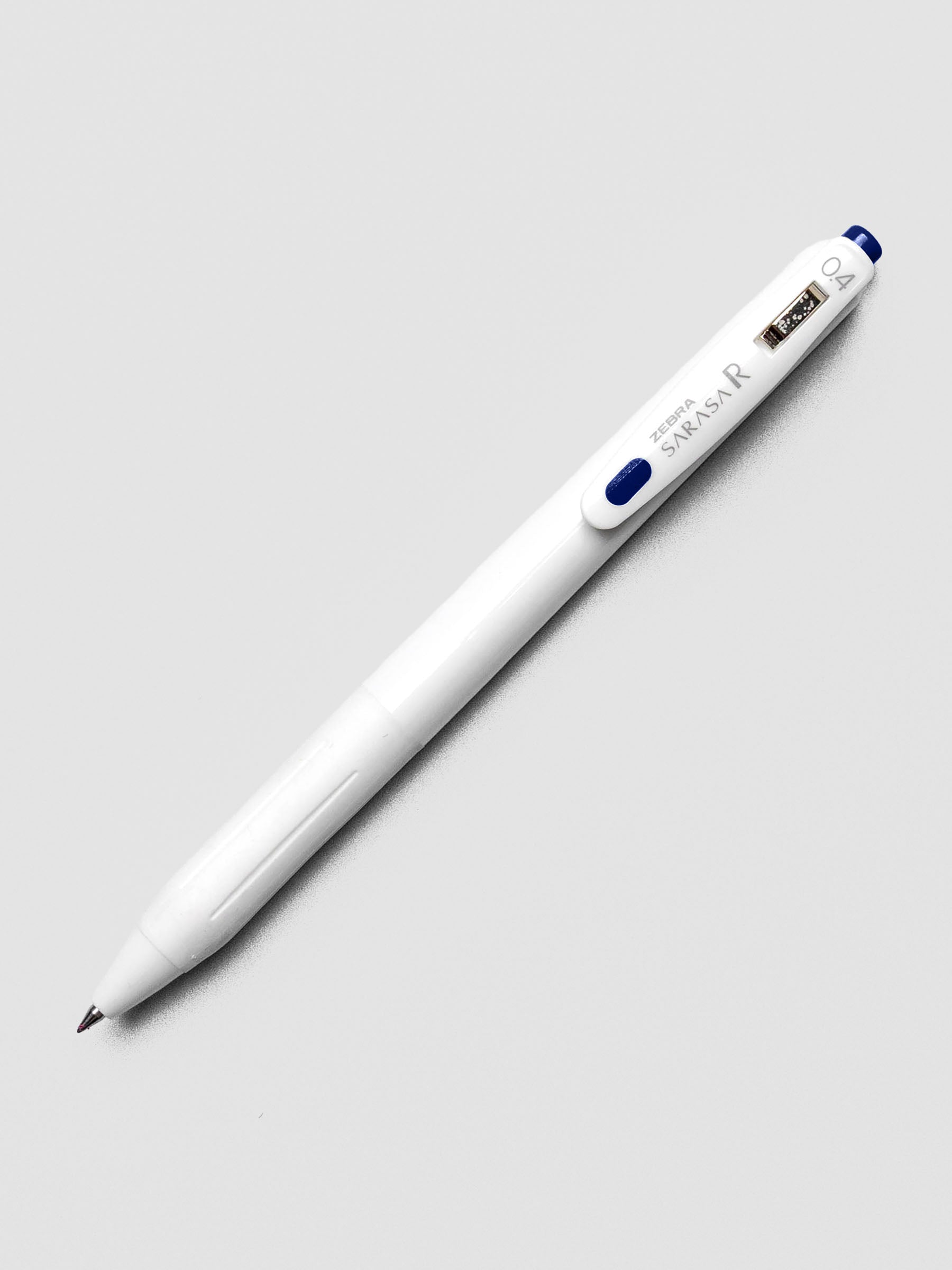 Zebra Sarasa R 0.4mm pen in blue-black ink with matching clip, on a white background.