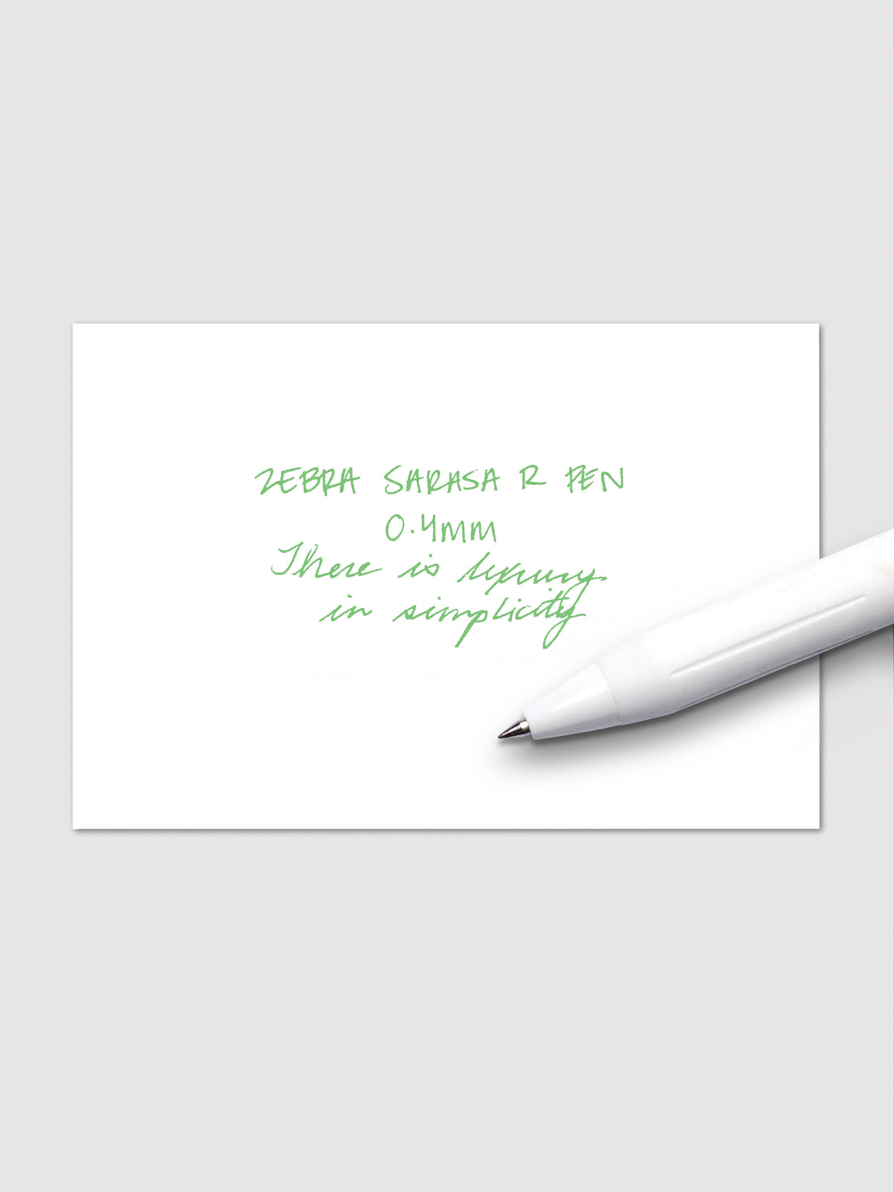 Writing sample using Zebra Sarasa R 0.4mm pen in fresh green ink on white paper.