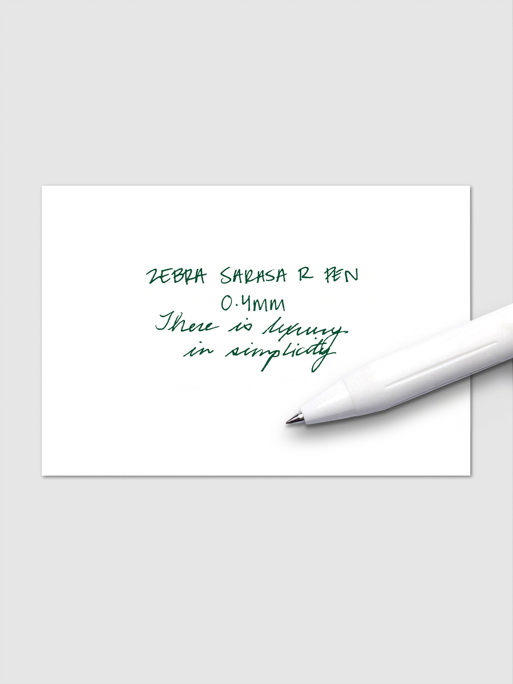 Writing sample using Zebra Sarasa R 0.4mm pen in green ink on white paper.