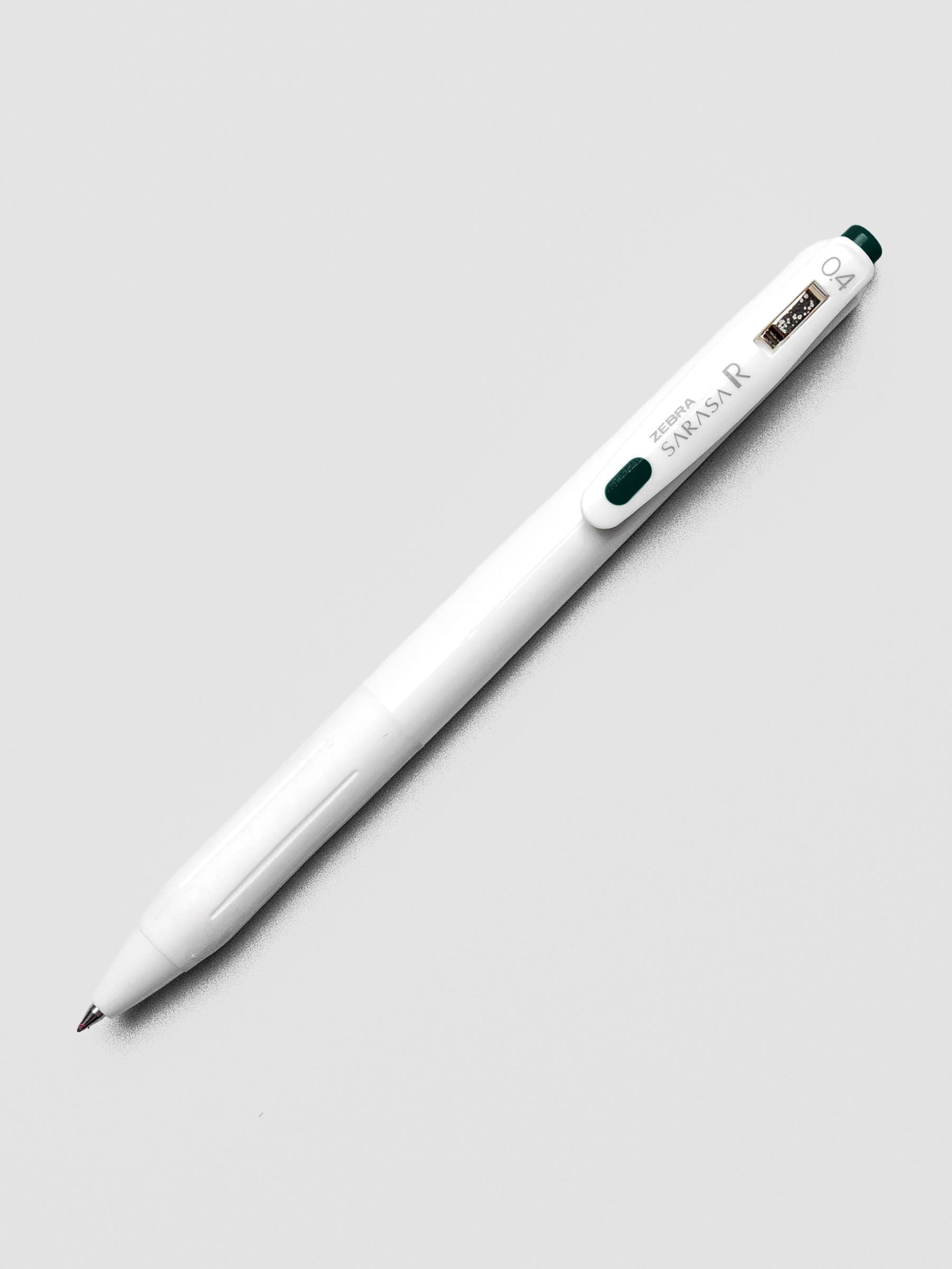 Zebra Sarasa R 0.4mm pen in green-black ink with matching clip, on a white background.