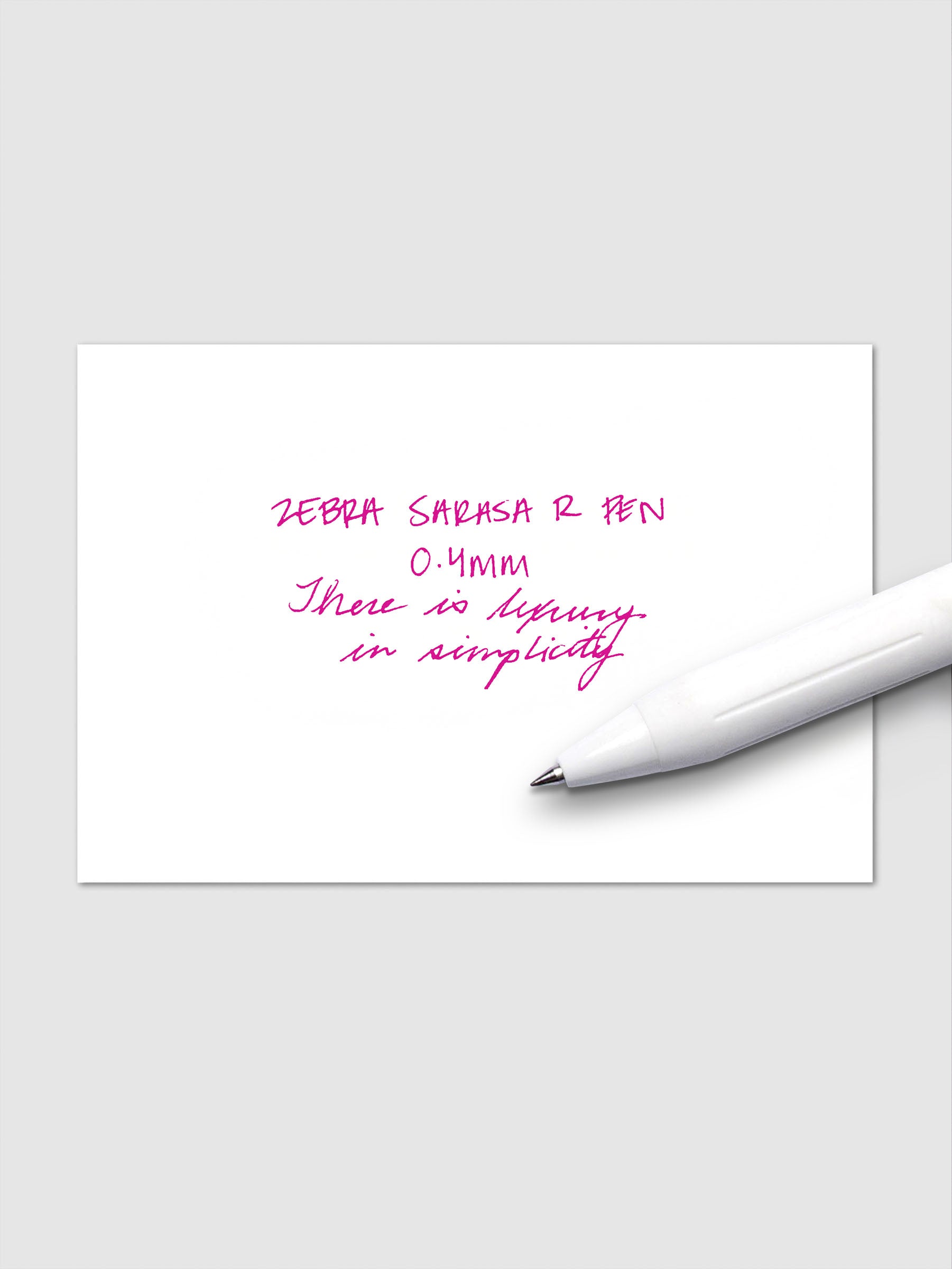 Writing sample using Zebra Sarasa R 0.4mm pen in magenta ink on white paper.