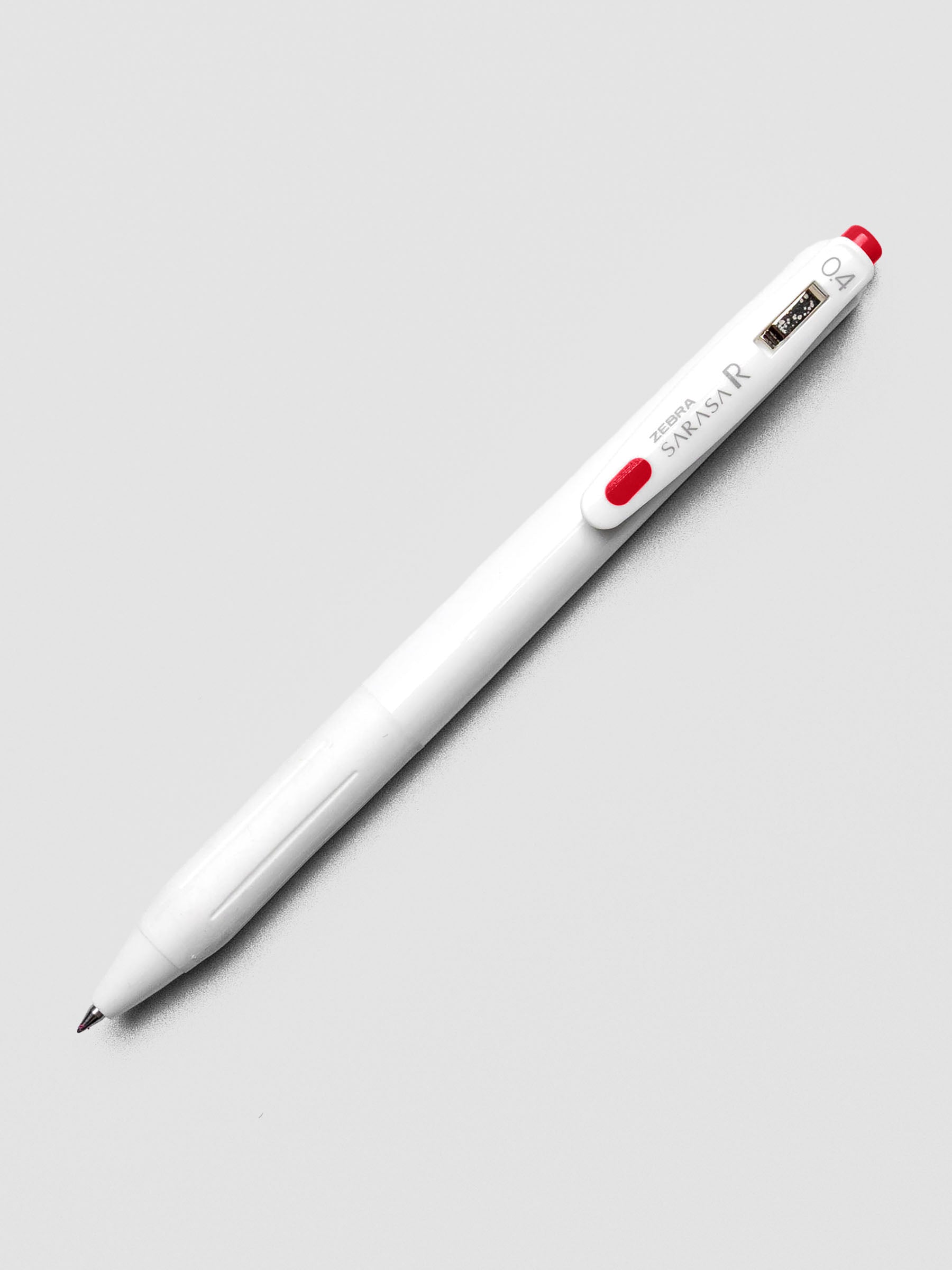 Zebra Sarasa R 0.4mm pen in red ink with matching clip, shown on a white background.