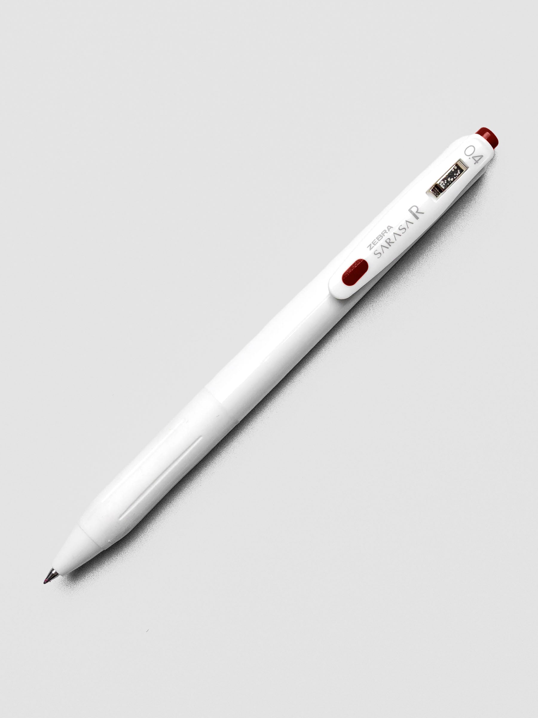 Zebra Sarasa R 0.4mm pen in red-black ink with matching clip, displayed on a white background.