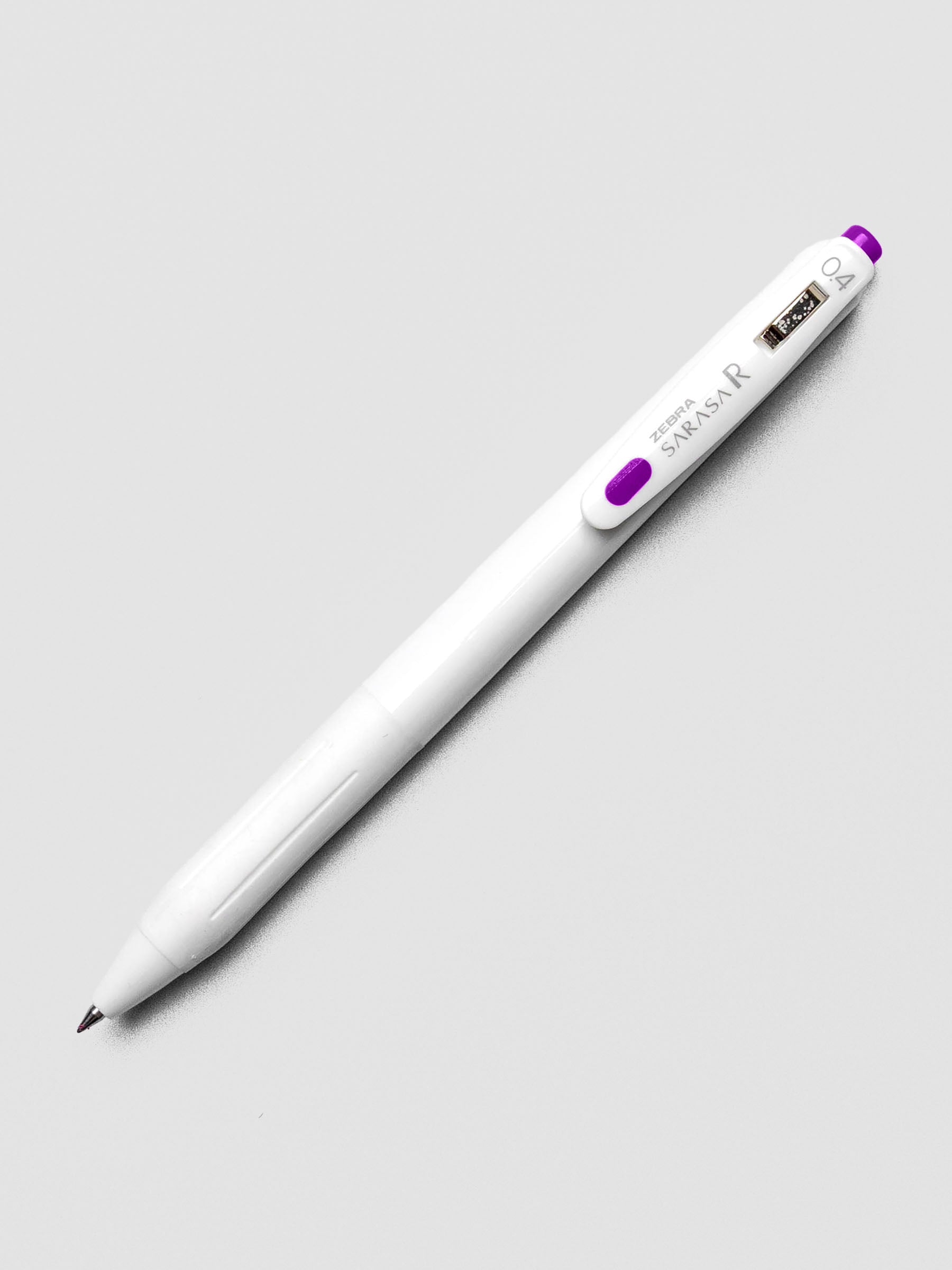 Zebra Sarasa R 0.4mm pen in violet ink with matching clip, displayed on a white background.