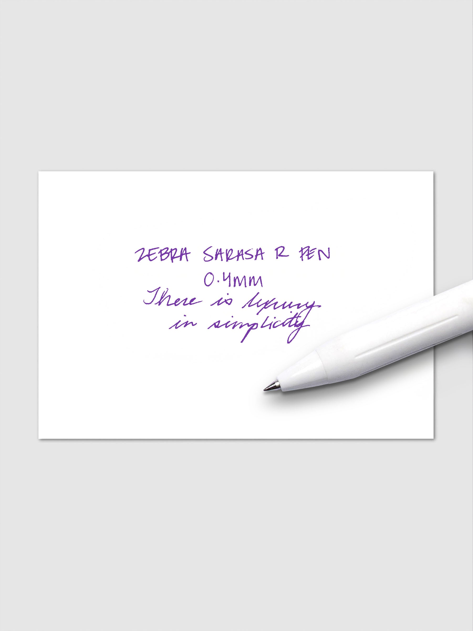 Writing sample using Zebra Sarasa R 0.4mm pen in violet ink on white paper.
