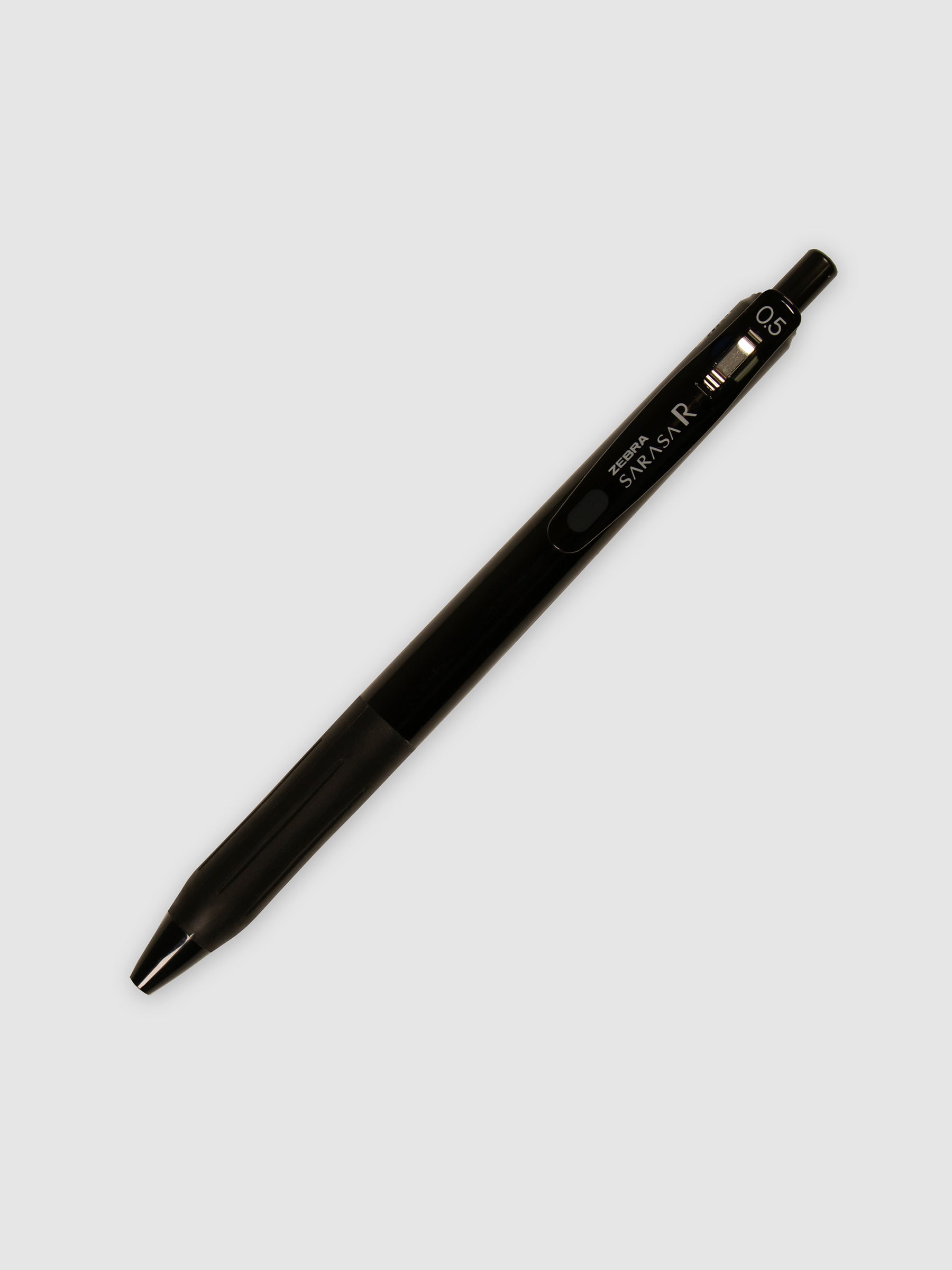 Zebra Sarasa R Pen, 0.5 mm, Black Ink, Black Body, Cloth and Paper. Pen turned to the right against a neutral background.