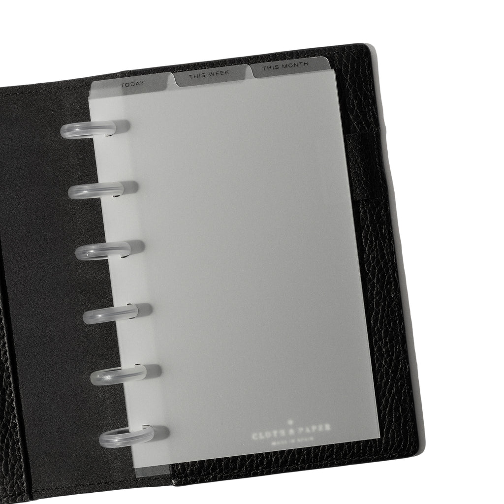 CP Petite Black Foil Cadence Tab Dividers displayed in a black leather planner.