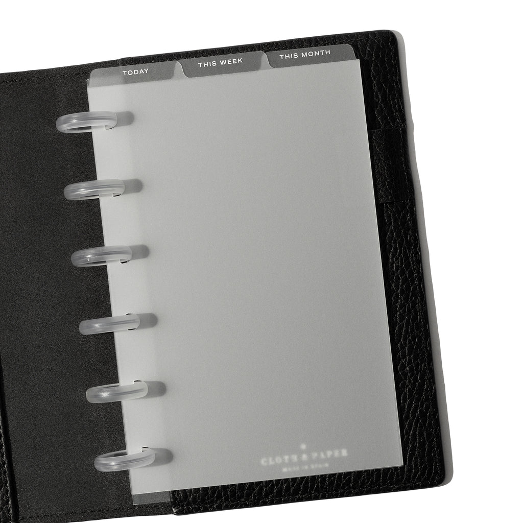 CP Petite White Foil Cadence Tab Dividers displayed in a black leather planner.