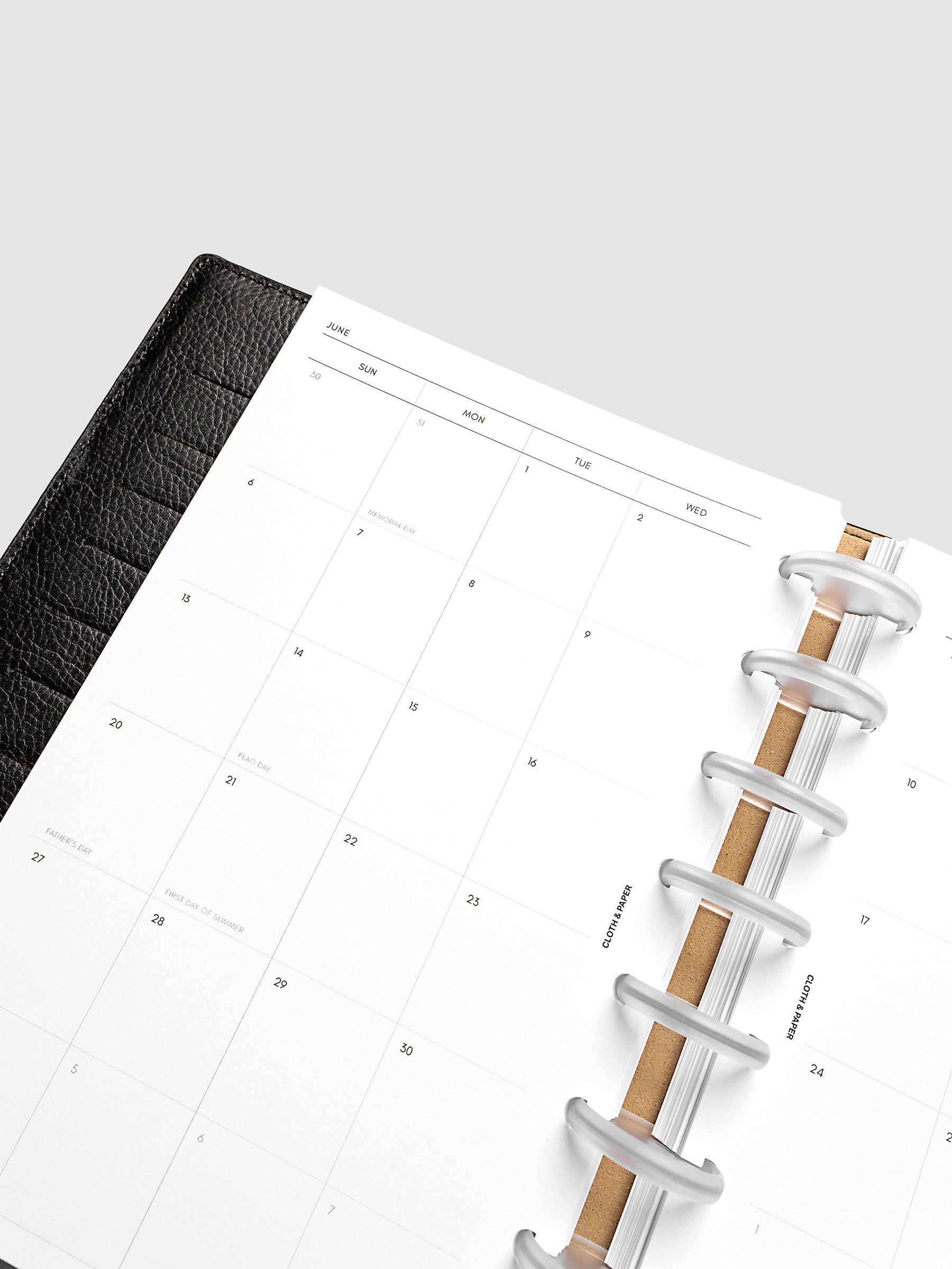 Close-up of the 2027 Dated Monthly Sunday Start left page in Half Letter 8-Disc Punch size, showing the dated calendar grid