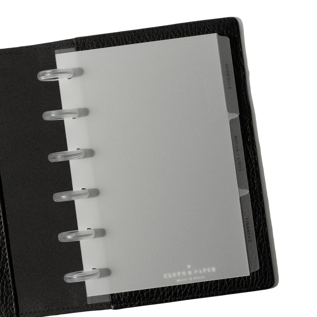 Black tab dividers displayed inside a black leather folio.