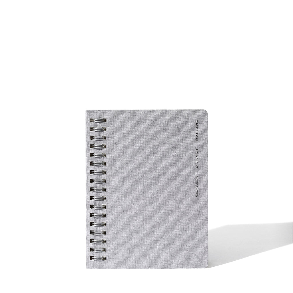 Linen notebook displayed on a white background.
