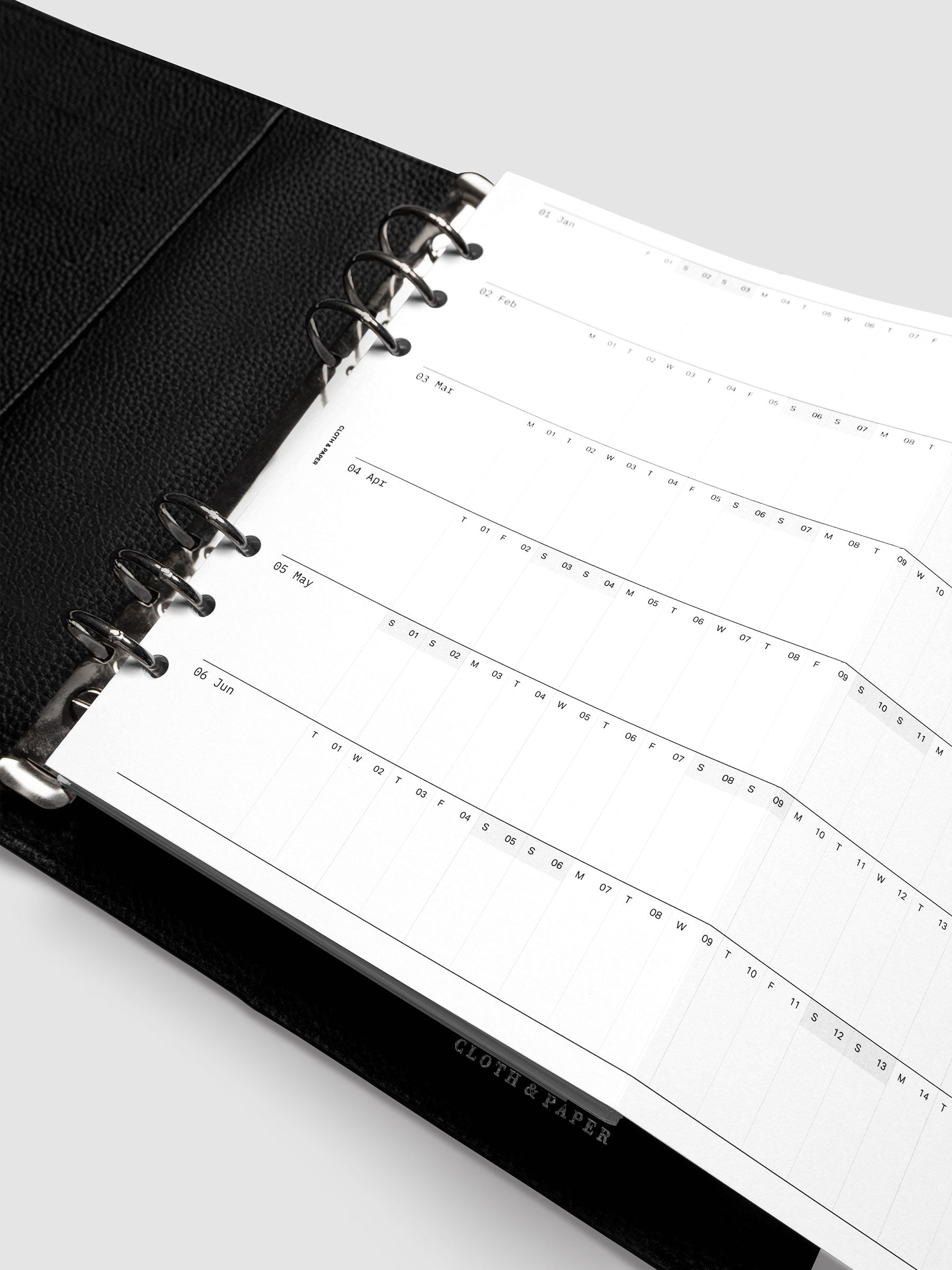 Close-up of the 2027 Dated Fold Out Insert inside an A5 6-ring planner, showing the small daily boxes used to mark holidays, birthdays, and key dates.