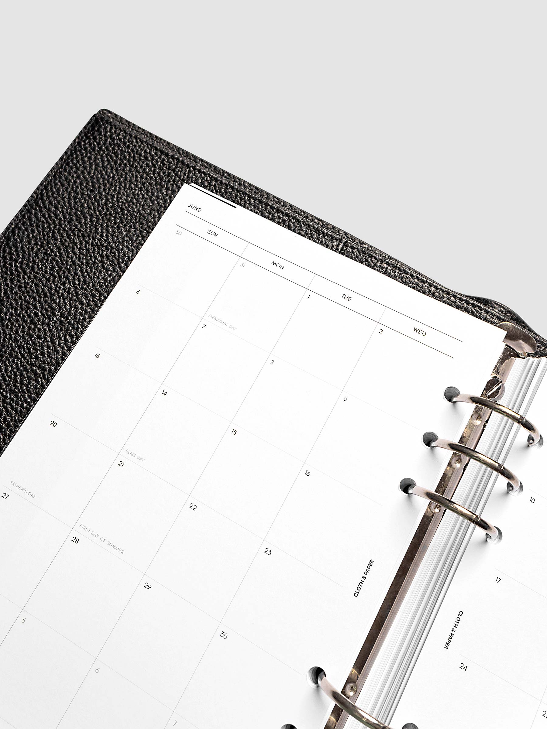 Close-up of the 2027 Dated Monthly Sunday Start left page in A5 6-Ring Punch size, showing the dated calendar grid