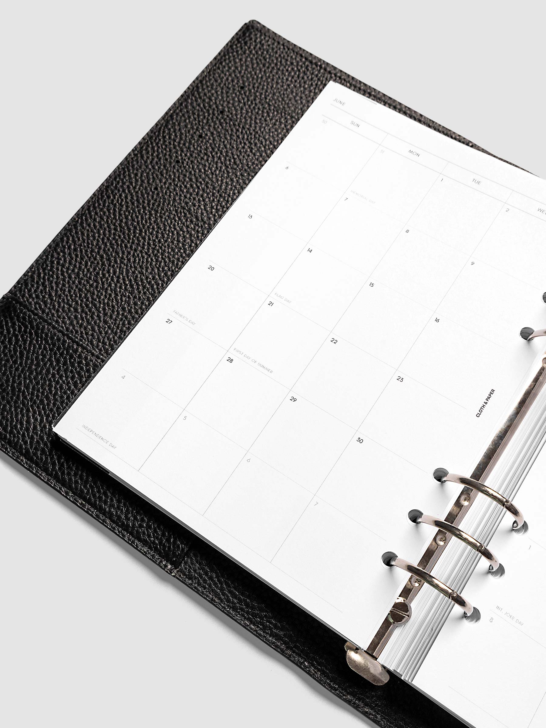 Close-up of the 2027 Dated Monthly Sunday Start left page in A5 6-Ring Punch size, showing the dated calendar grid and day cell