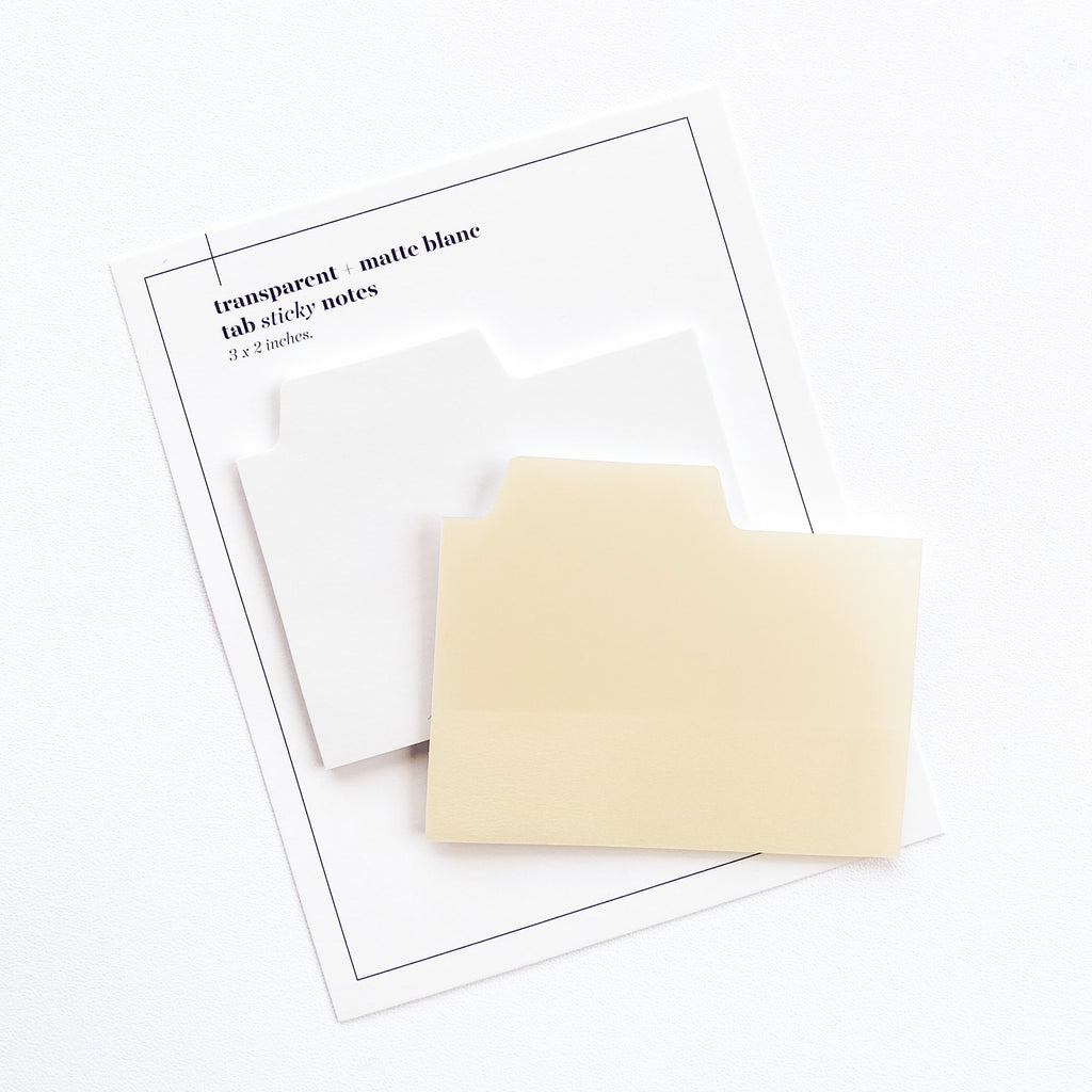Blank Tab Sticky Note Set, Blanc, Cloth and Paper. Sticky note set displayed against a white background. The matte sticky note pad is attached to the sticky note backing, while the transparent sticky note pad is layered on top of it, turned slightly to the right.