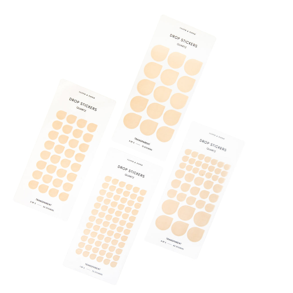 Minimal Shape Sticker Set, Transparent, Drops, Quartz, Cloth and Paper. 4 sheets of teardrop shaped stickers in 3 different sizes against a white background, tilted slightly to the right.