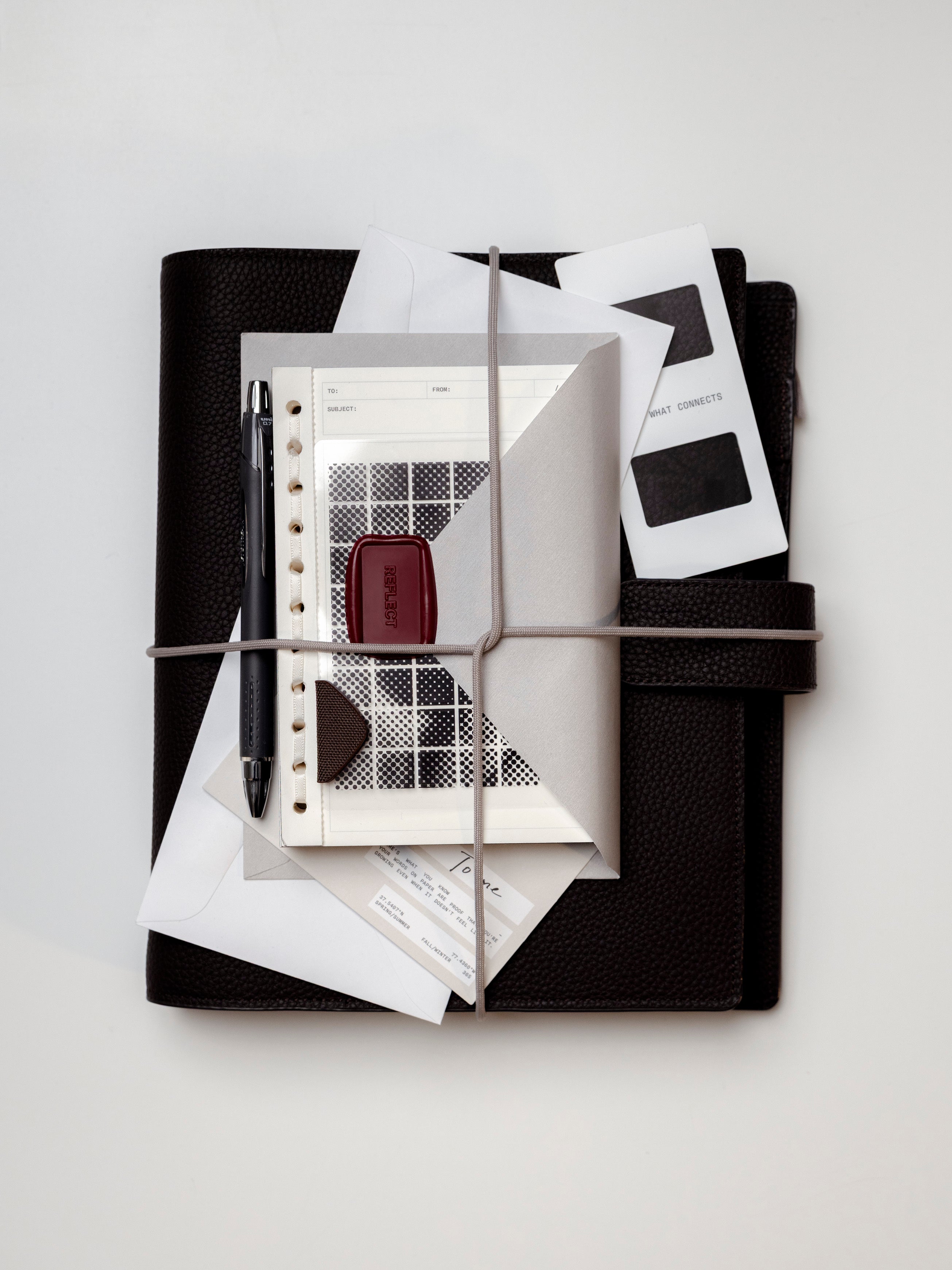 The Foundations 6-Ring Leather Agenda serves as a curated hub, bundled here with the March 2026 Intention Box essentials. The set includes a sleek black pen, chic inserts and a signature deep red wax seal, all secured for a season of thoughtful "sending."